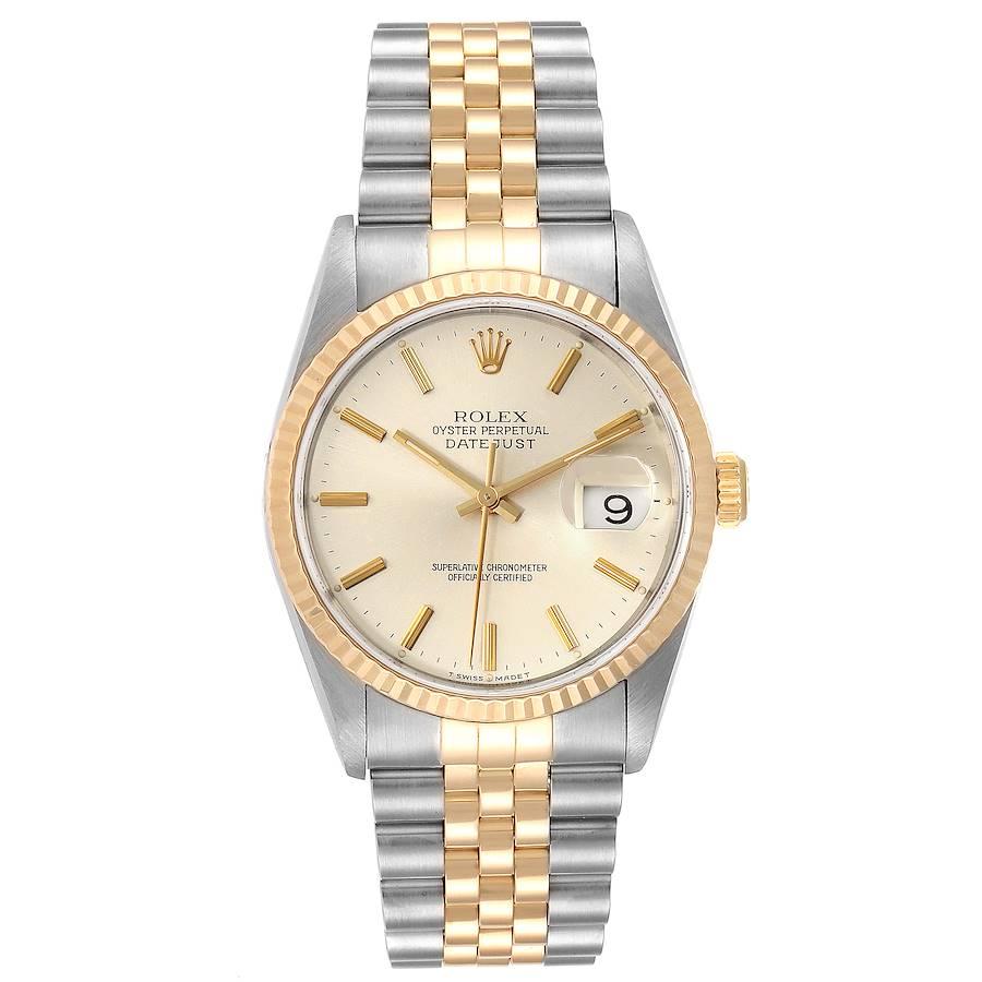Rolex Datejust Steel Yellow Gold Silver Dial Mens Watch 16233. Officially certified chronometer self-winding movement. Stainless steel case 36 mm in diameter.  Rolex logo on a 18K yellow gold crown. 18k yellow gold fluted bezel. Scratch resistant