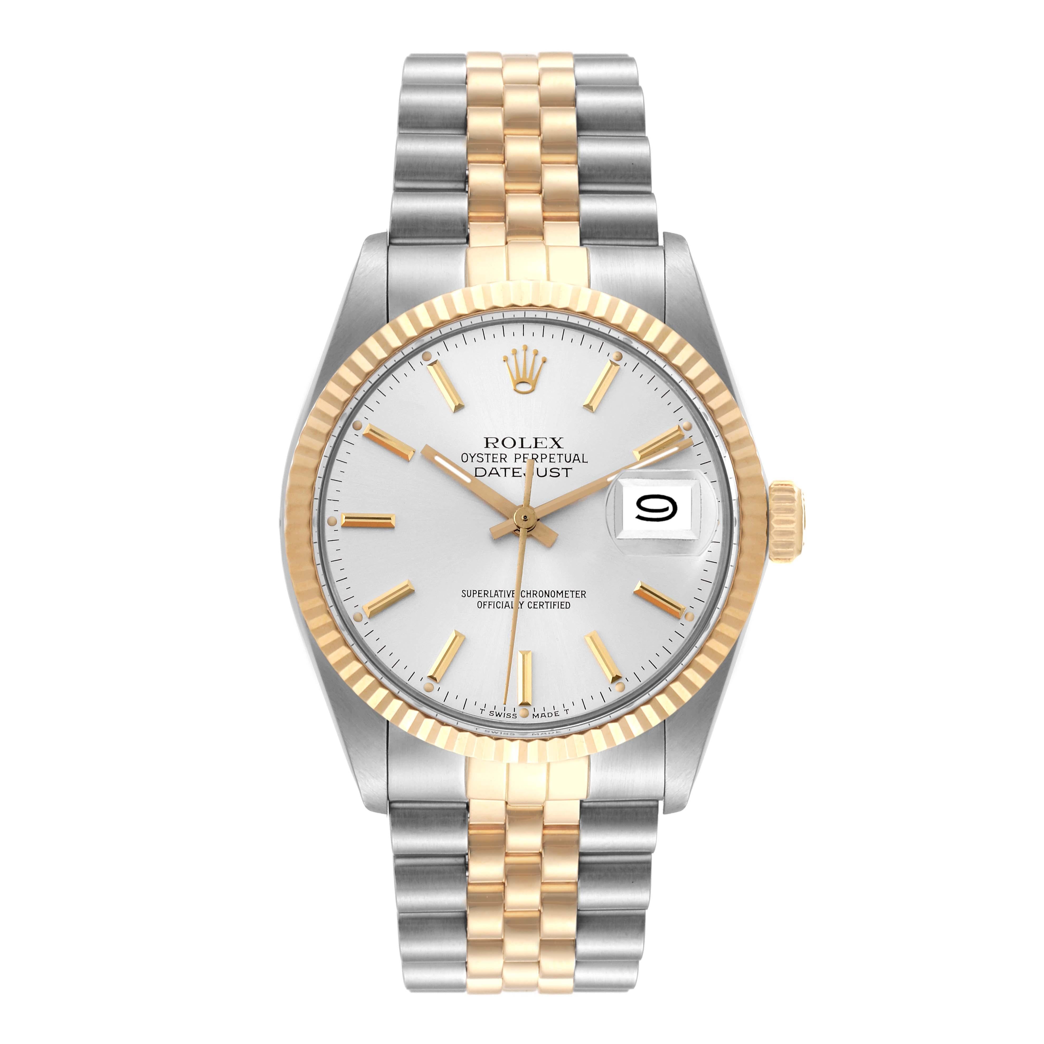 Rolex Datejust Steel Yellow Gold Silver Dial Vintage Mens Watch 16013. Officially certified chronometer self-winding movement. Stainless steel oyster case 36.0 mm in diameter. Rolex logo on a crown. 18k yellow gold fluted bezel. Acrylic crystal with