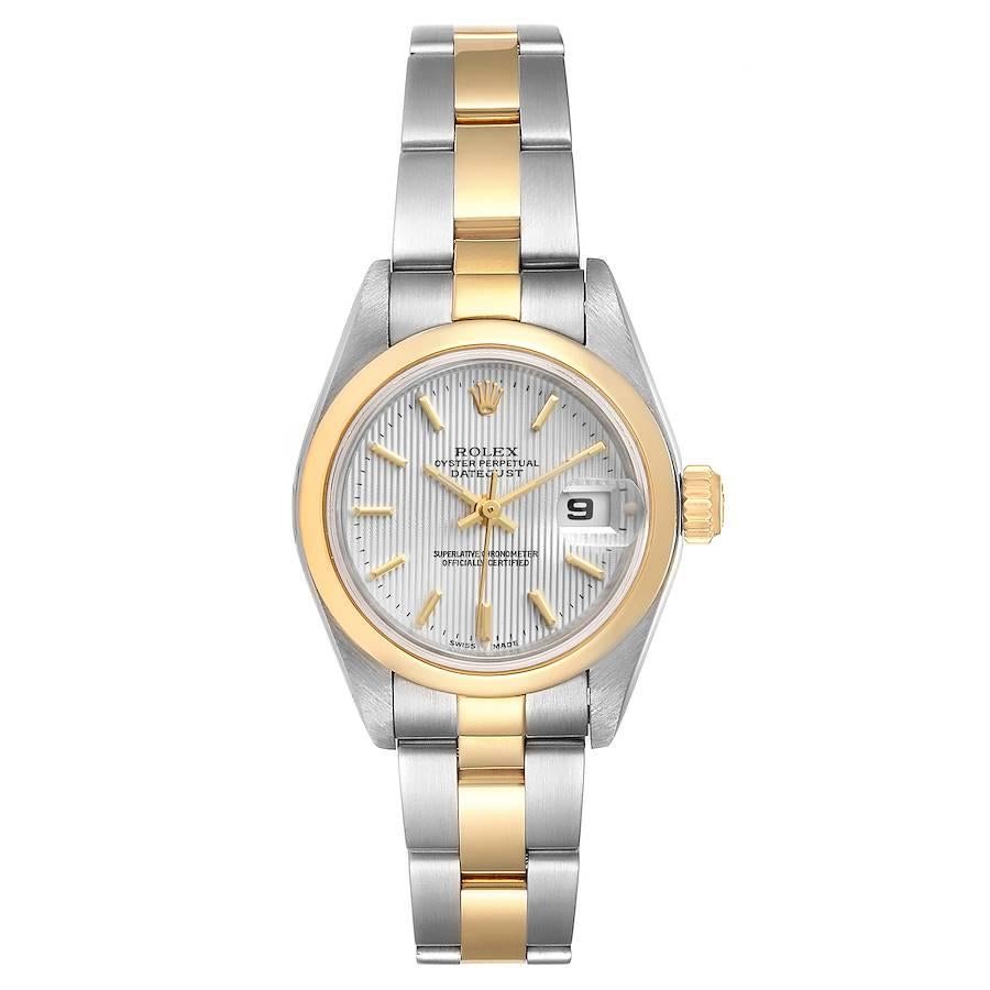 Rolex Datejust Steel Yellow Gold Silver Tapestry Dial Ladies Watch 79163. Officially certified chronometer self-winding movement. Stainless steel oyster case 26 mm in diameter. Rolex logo on a 18k yellow gold crown. 18k yellow gold smooth domed