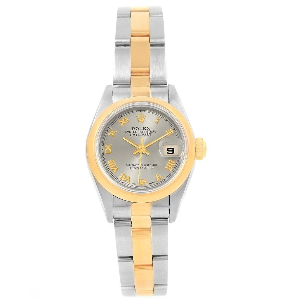 Rolex Datejust Steel Yellow Gold Slate Dial Ladies Watch 69163. Officially certified chronometer automatic self-winding movement. Stainless steel oyster case 26.0 mm in diameter. Rolex logo on a crown. 18k yellow gold smooth bezel. Scratch resistant