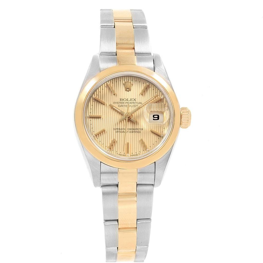 Rolex Datejust Steel Yellow Gold Tapestry Dial Ladies Watch 69163. Officially certified chronometer self-winding movement. Stainless steel oyster case 26 mm in diameter. Rolex logo on a 18k yellow gold crown. 18k yellow gold smooth domed bezel.