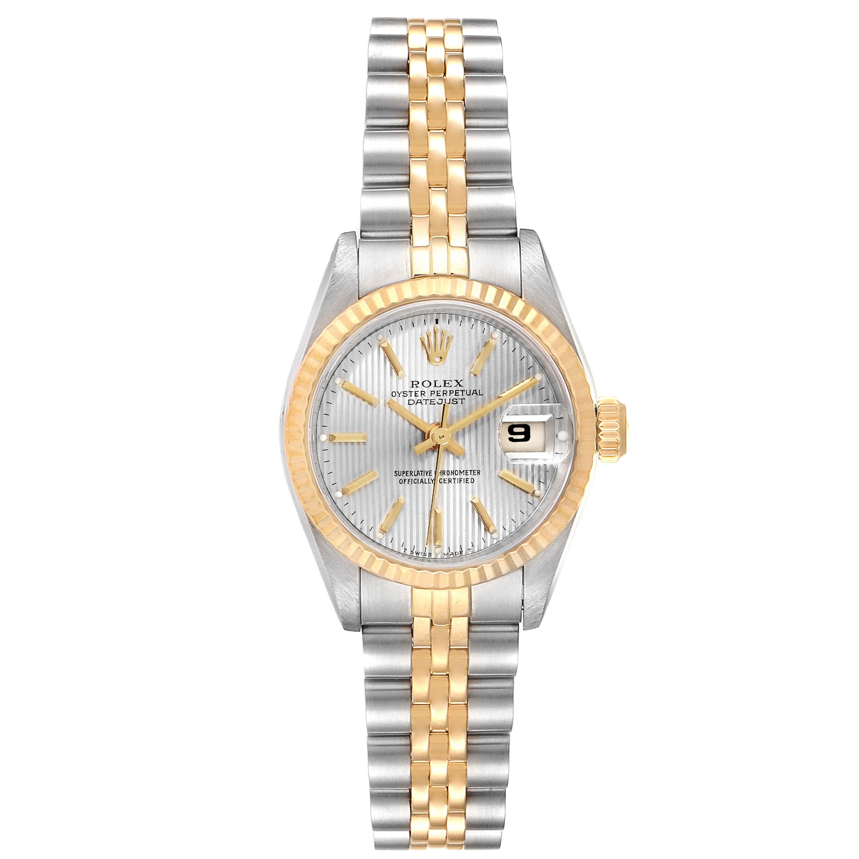 Rolex Datejust Steel Yellow Gold Tapestry Dial Ladies Watch 69173 Box Papers. Officially certified chronometer self-winding movement. Stainless steel oyster case 26 mm in diameter. Rolex logo on a crown. 18k yellow gold fluted bezel. Scratch