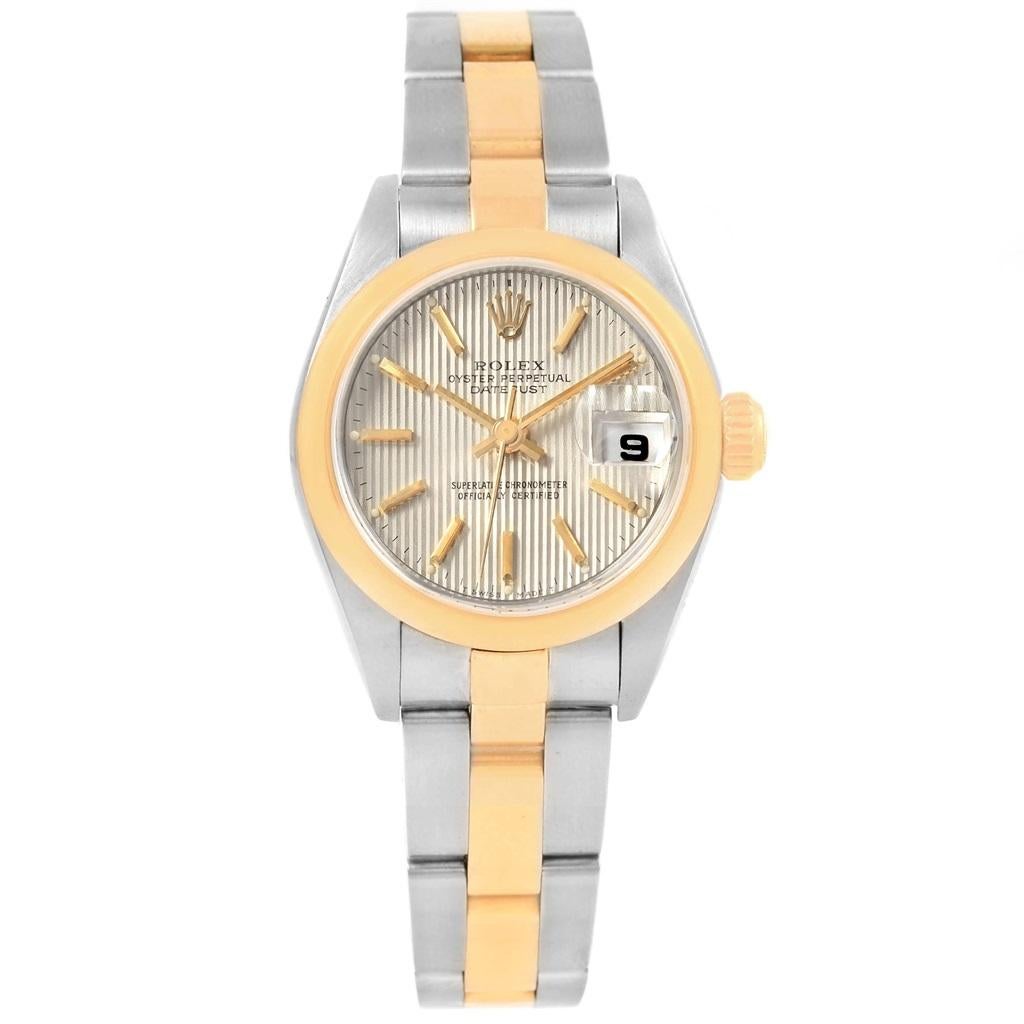 Rolex Datejust Steel Yellow Gold Tapestry Dial Ladies Watch 79163. Officially certified chronometer automatic self-winding movement. Stainless steel oyster case 26 mm in diameter. Rolex logo on a 18k yellow gold crown. 18k yellow gold smooth domed