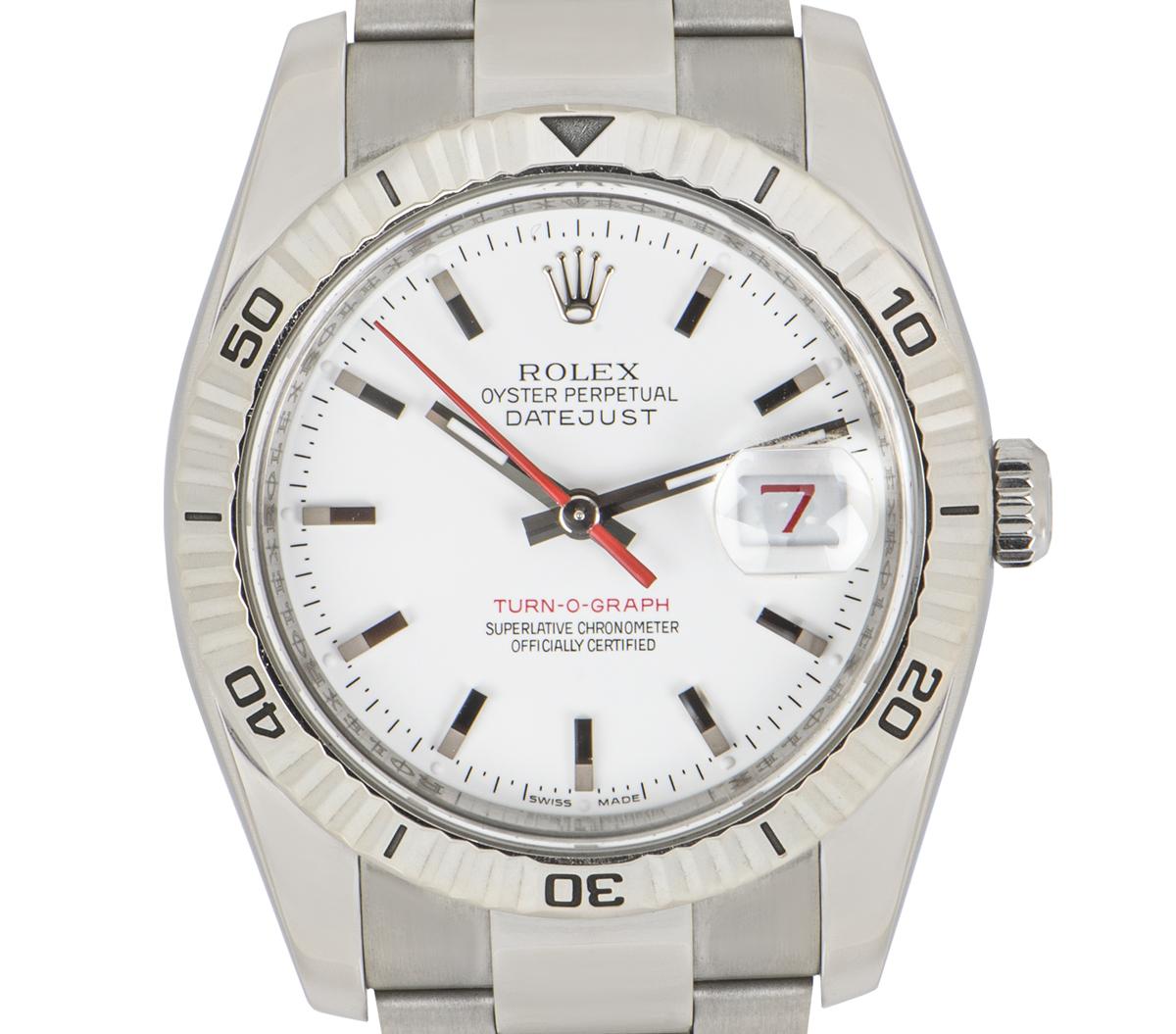 A stainless steel Datejust Turn-O-Graph by Rolex. Features a white dial and a fluted, white gold bidirectional rotatable bezel. The Oyster bracelet is equipped with a folding Oysterclasp. Fitted with scratch resistant sapphire crystal and a