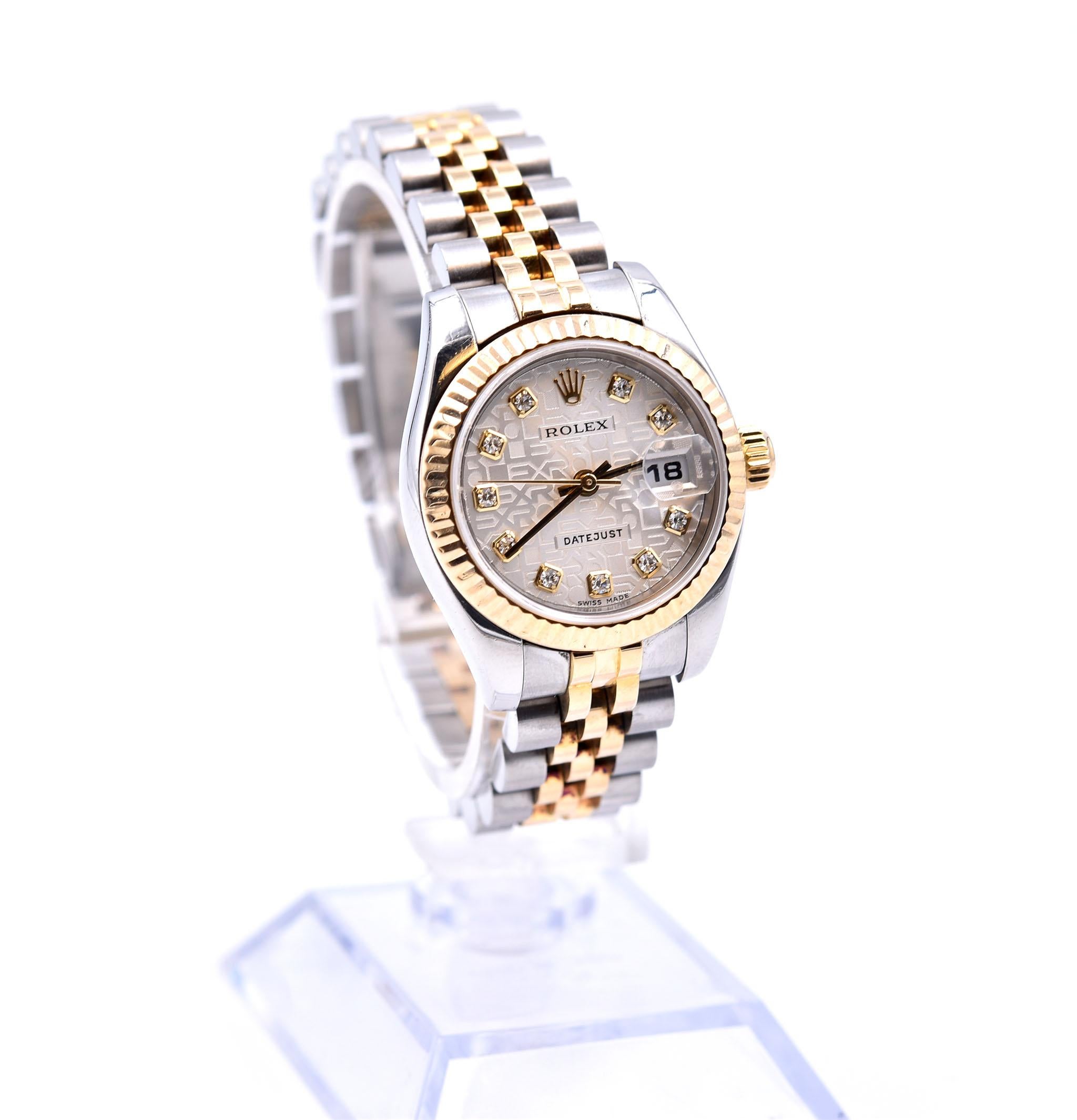 Movement: automatic 
Function: hours, minutes, seconds, date
Case: 26mm stainless steel case with 18k yellow gold fluted bezel, 18k yellow gold screw-down crown, sapphire crystal, water resistant to 100 meters
Band: stainless steel and 18k yellow