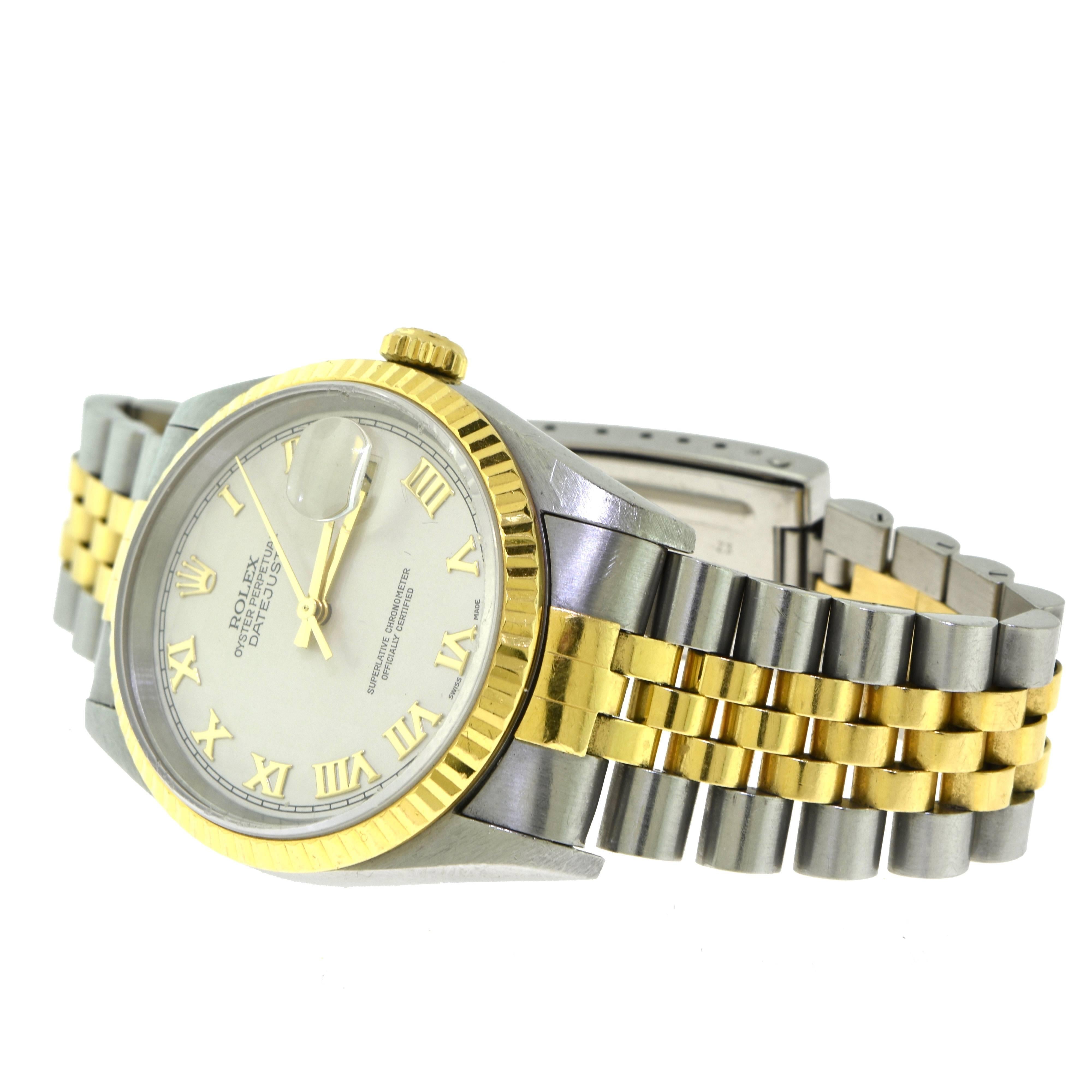Rolex Datejust Two Tone Gold or Steel Ivory Pyramid Roman Dial Model 16233 Watch In Good Condition For Sale In Miami, FL