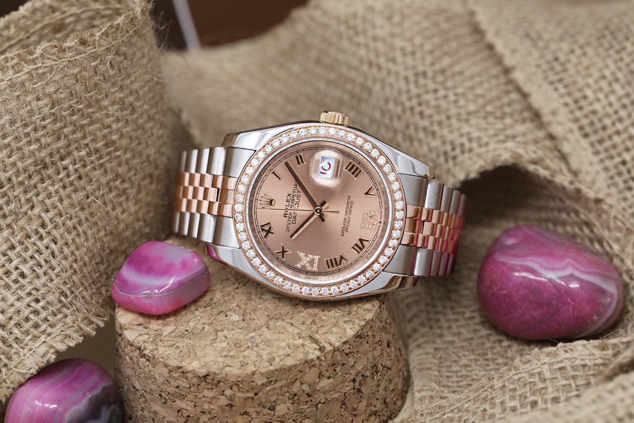Rolex Datejust 116261 Two Tone Stainless Steen and Rose Gold Watch with Custom Made Pink Roman Diamond Dial and custom Diamond Bezel. Diamonds are 100% natural!

