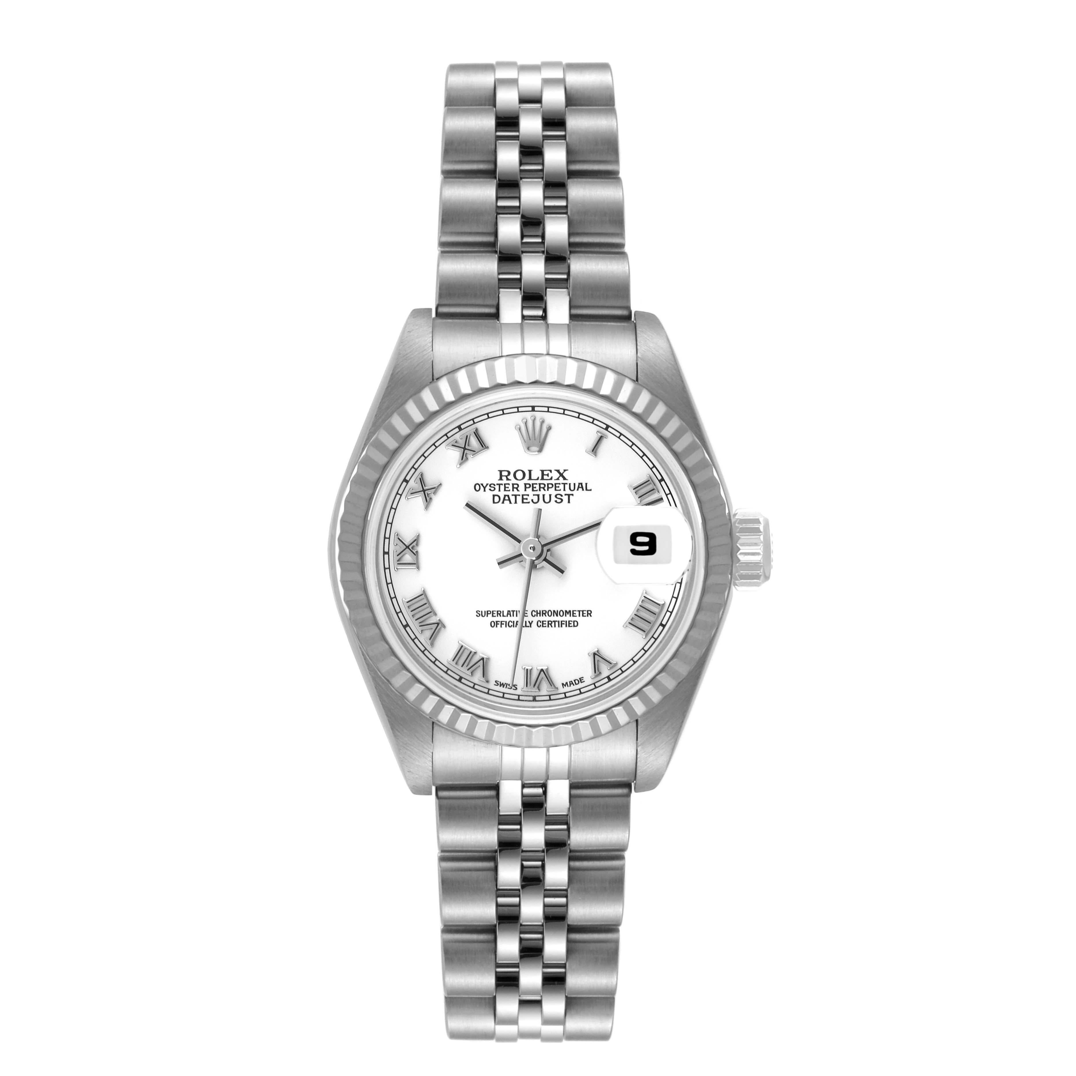 Rolex Datejust White Gold Roman Dial Steel Ladies Watch 79174. Officially certified chronometer automatic self-winding movement. Stainless steel oyster case 26.0 mm in diameter. Rolex logo on the crown. 18K white gold fluted bezel. Scratch resistant