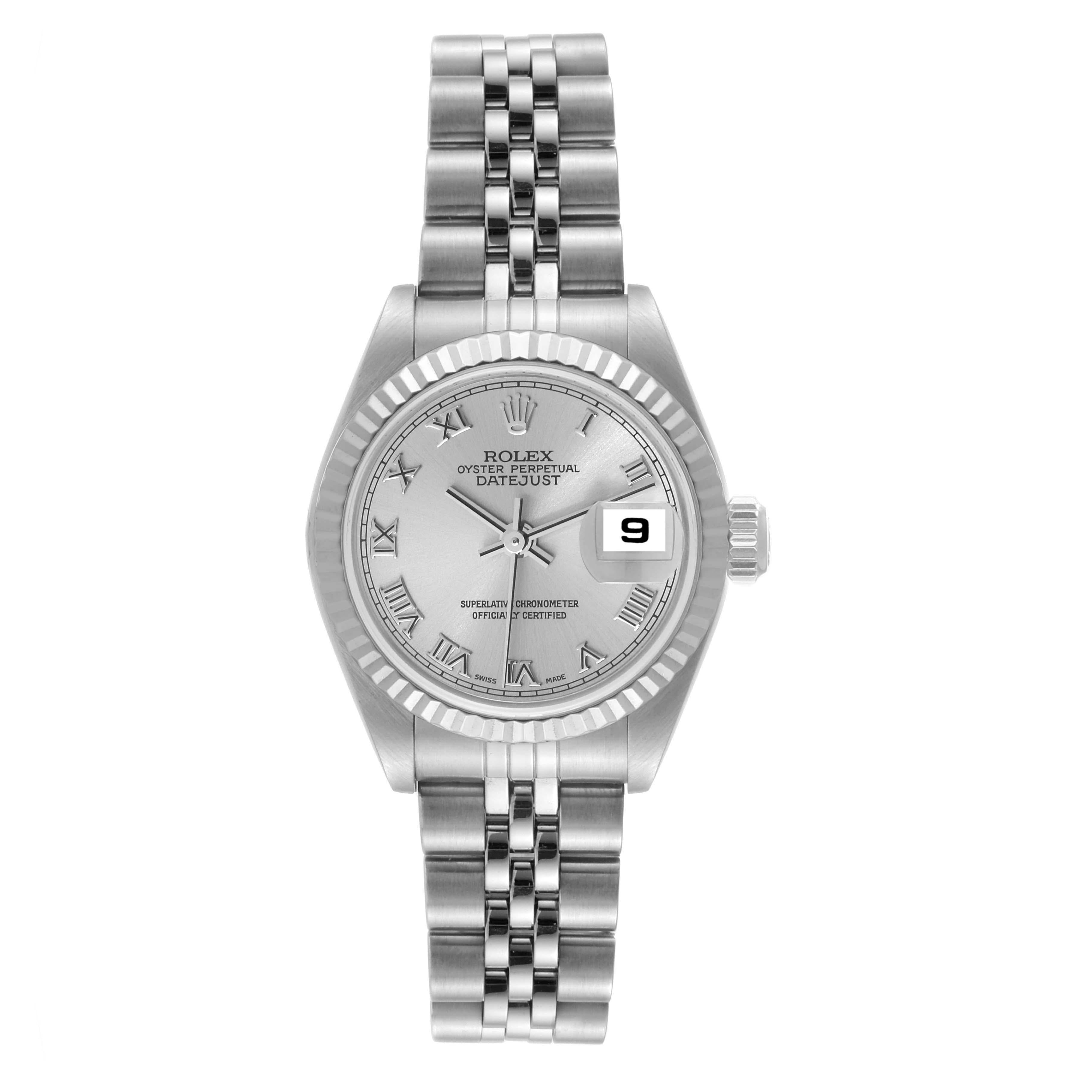Rolex Datejust White Gold Silver Roman Dial Steel Ladies Watch 79174. Officially certified chronometer automatic self-winding movement. Stainless steel oyster case 26.0 mm in diameter. Rolex logo on the crown. 18K white gold fluted bezel. Scratch