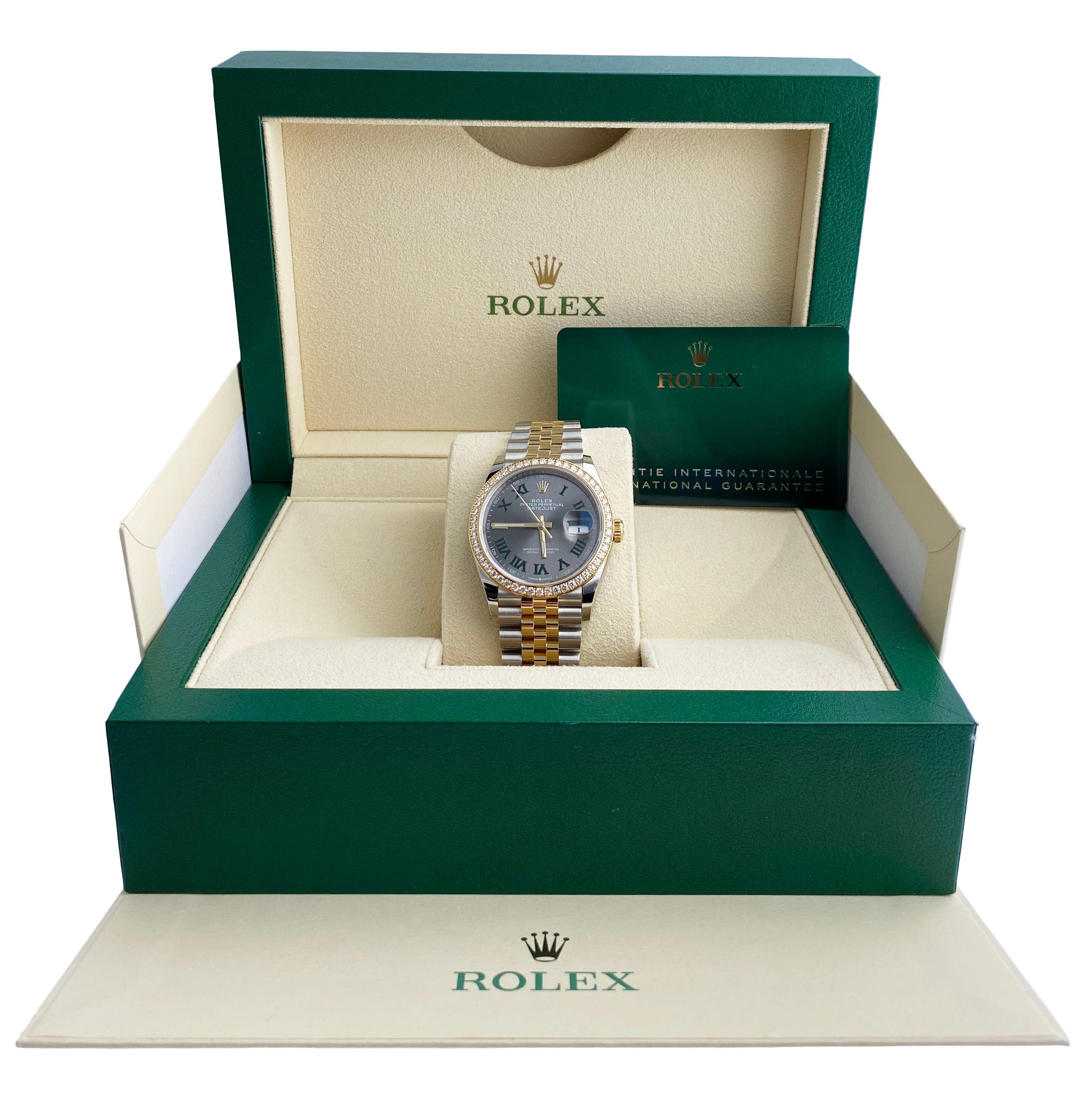 
Rolex Datejust Wimbledon 126283RBR Mens Watch. 36mm stainless steel case. 18K yellow gold bezel with original factory diamond set. Silver-grey dial with yellow gold luminous hands. Roman numerals and luminous index hour marker. Date display at a 3