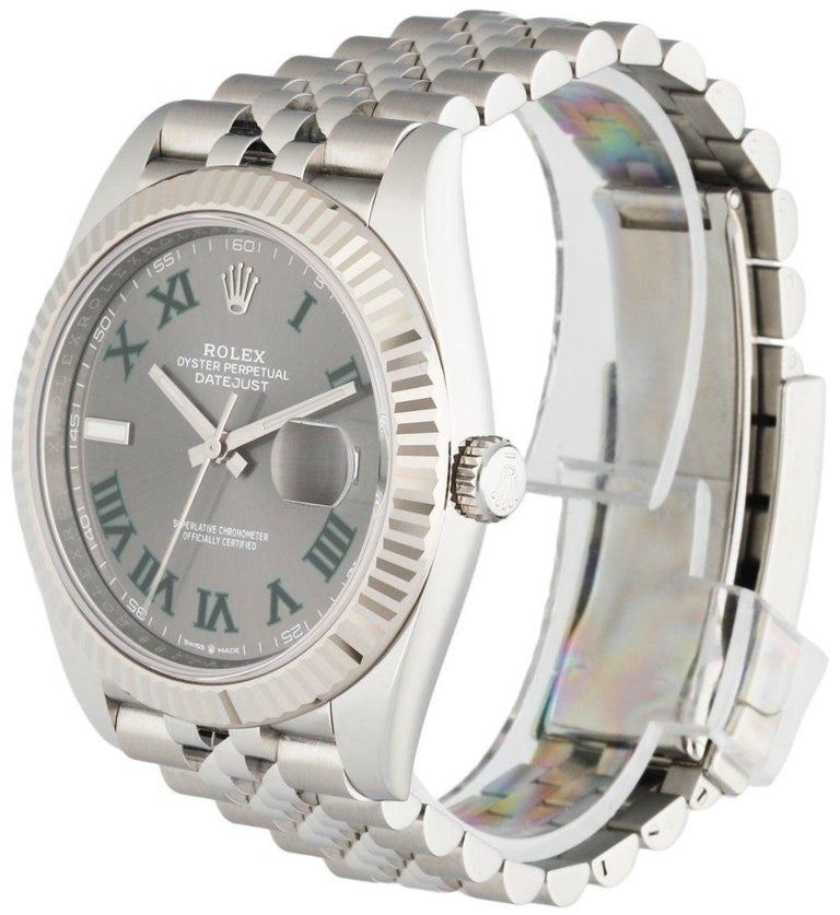 
Rolex Datejust Wimbledon 126334 Stainless steel Men's Watch. 41MM stainless steel case with 18K White gold fluted bezel. Silver-grey dial with white gold luminous hands and luminous index hour marker. Date display at a 3 o'clock position. Stainless