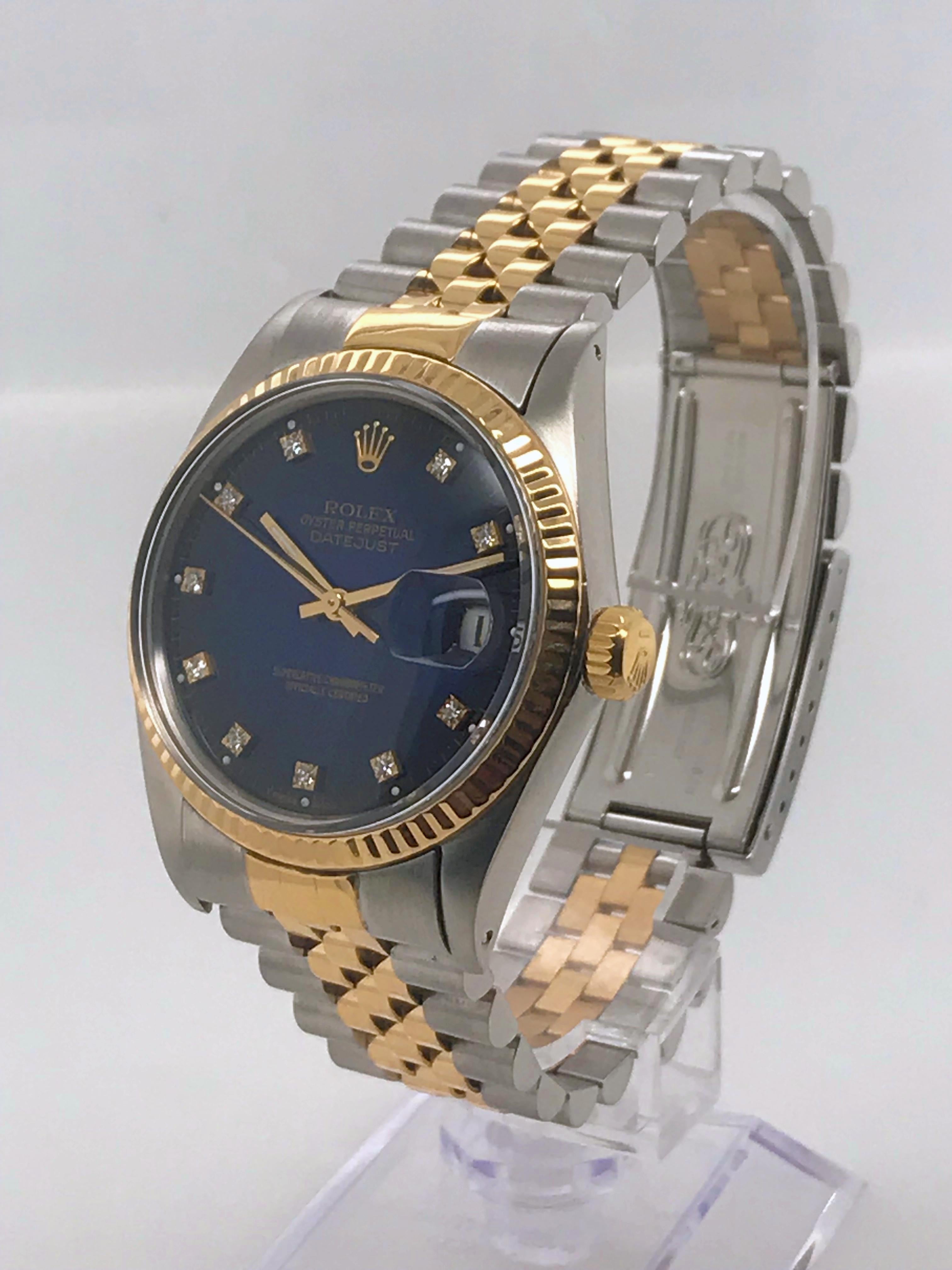 This two-tone Rolex Datejust is a classic 36mm size on a two-tone Jubilee bracelet. It features a rich blue dial and diamond markers as well as a date window at the 6 o’clock position. 
	
This timepiece was recently serviced and authenticated by a
