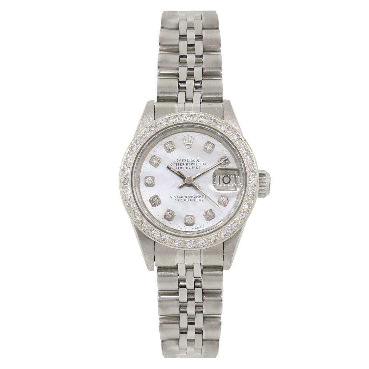 Brand: Rolex
MPN: 69160
Model: Datejust
Case Material: Stainless steel
Case Diameter: 26mm
Crystal: Sapphire crystal
Bezel: Diamond bezel (aftermarket)
Dial: Mother of pearl dial diamond dial with date window at the 3 o’clock position