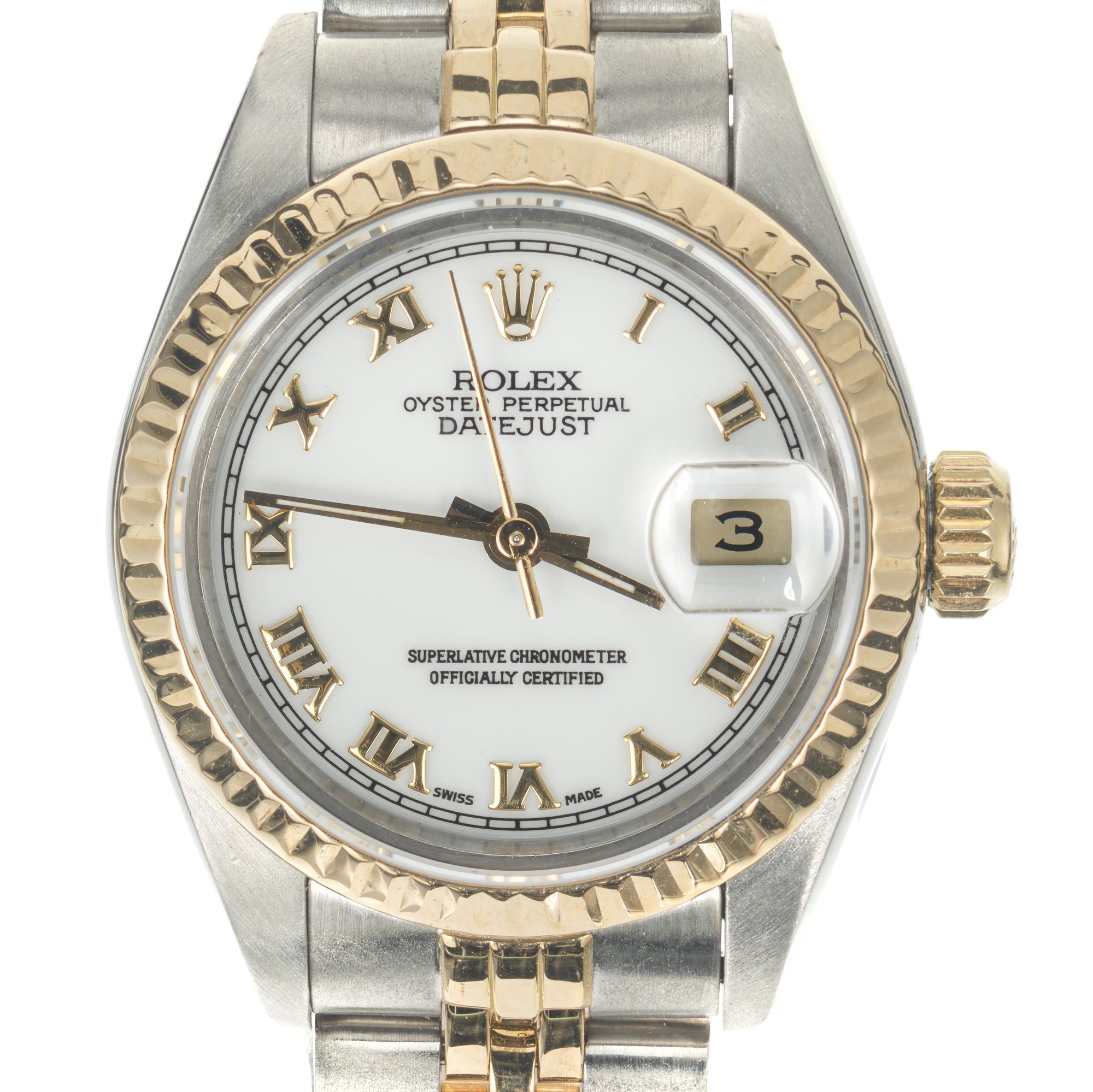 Ladies restored mid 1980's Rolex Datejust women's wristwatch. 18k yellow gold and steel jubilee band and case. White dial with Roman numeral markers.  

Length: 32mm
Width: 26mm
Band width at case: 13mm
Case thickness: 11.56mm
Band: two tone