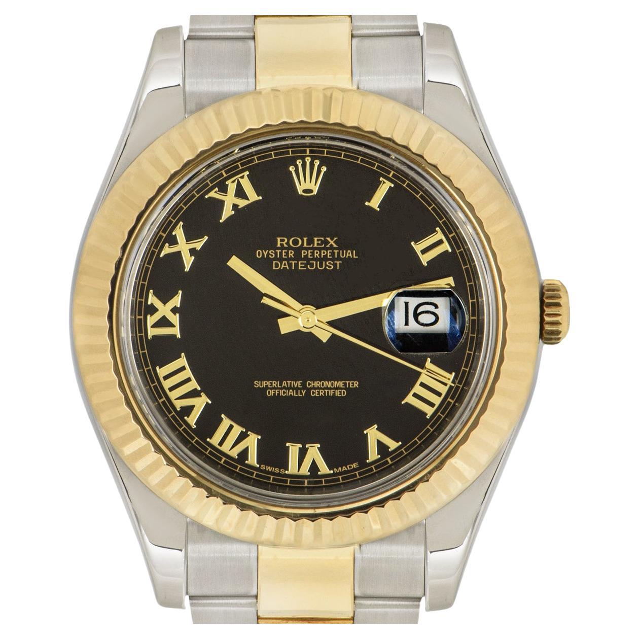 A 41mm Datejust II in Oystersteel and yellow gold by Rolex. Featuring a black dial with applied roman numerals and a fluted yellow gold bezel. Fitted with scratch-resistant sapphire crystal and a self-winding automatic movement. The Oyster bracelet