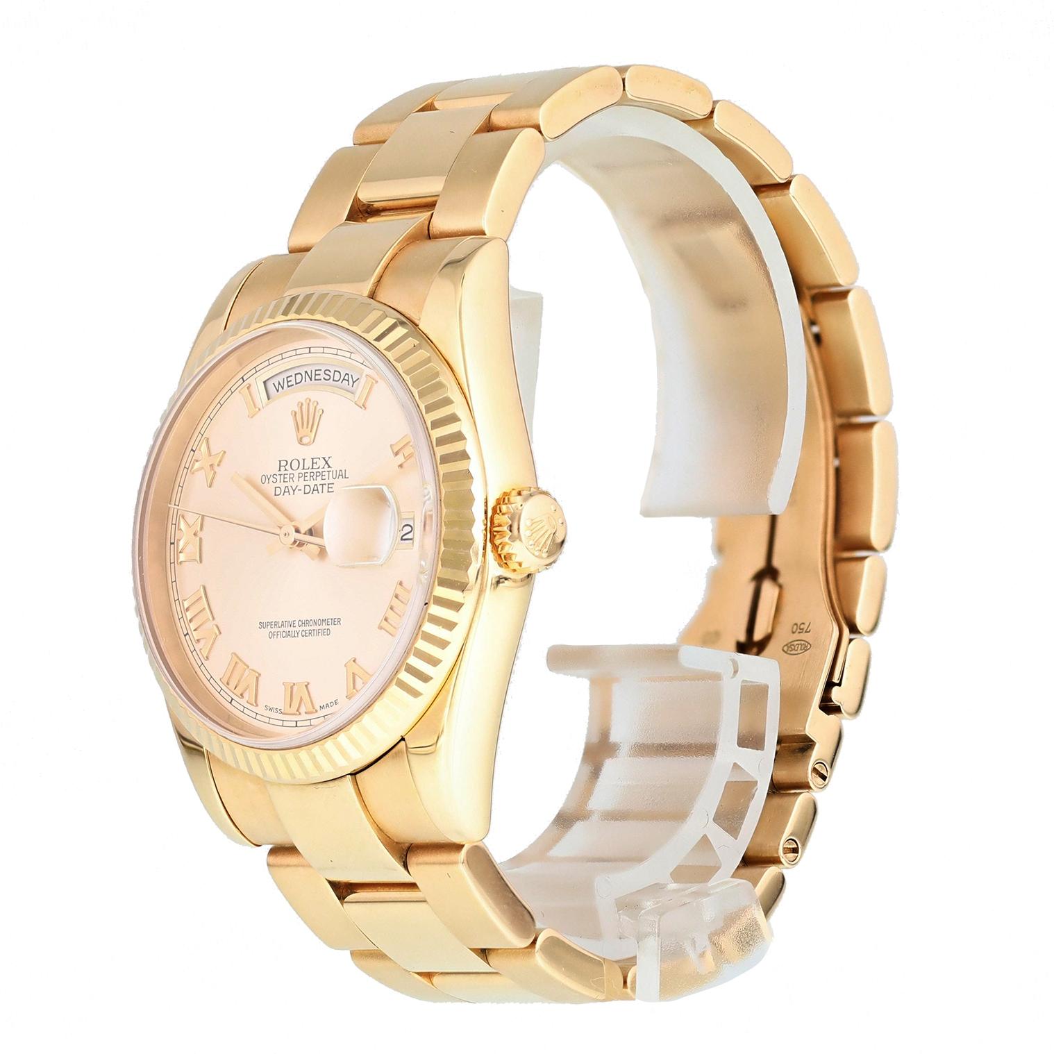 Rolex Day Date 118235 President 18k Rose Gold Watch. 
36mm 18k Rose Gold case. 
White Gold Stationary bezel. 
Pink dial with Luminous gold hands and index hour markers. 
Minute markers on the outer dial. 
Date display at the 3 o'clock position.