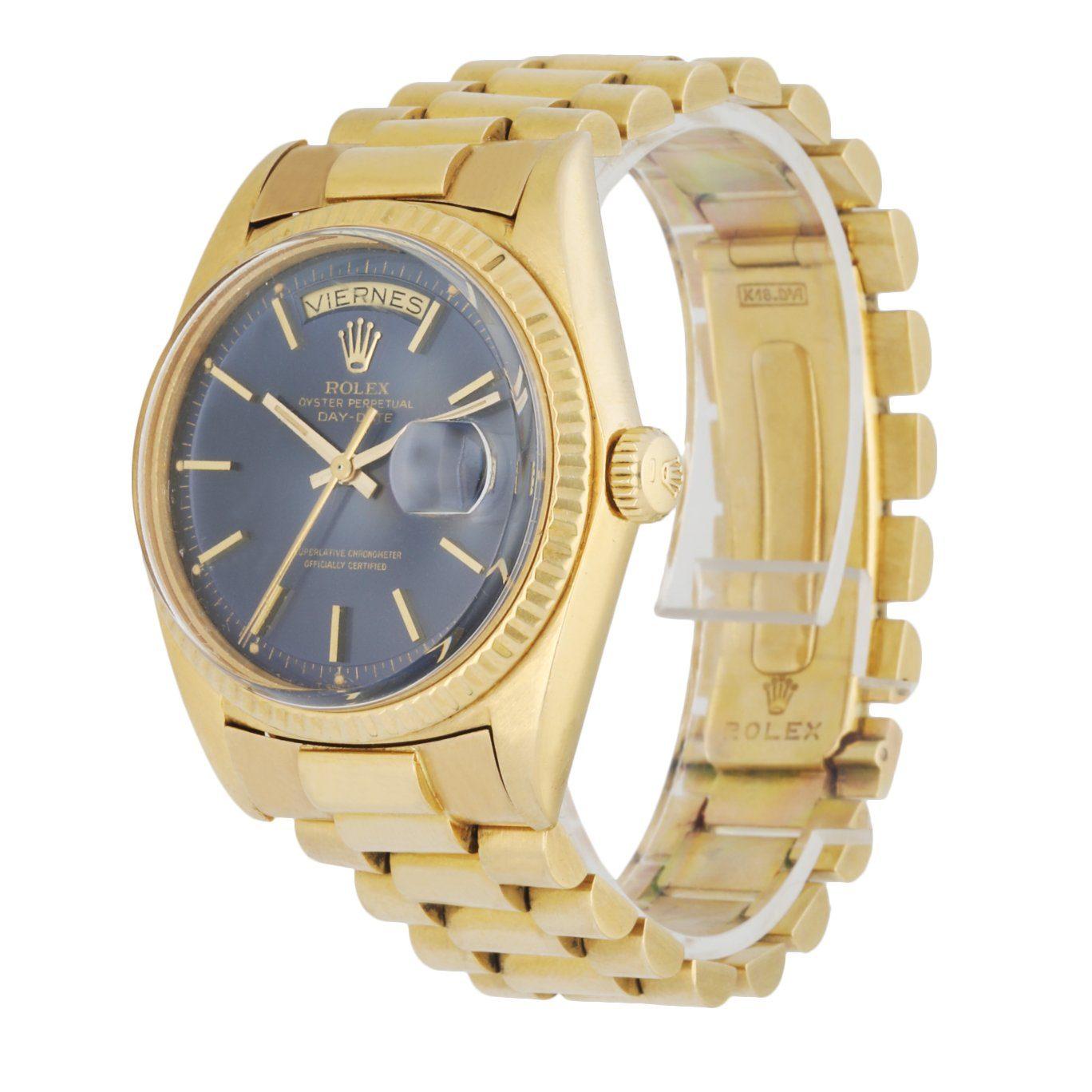 Rolex Day-Date 1803 Men's Watch. 36mm 18k Yellow gold case with 18K yellow gold fluted bezel. Blue dial with gold hands and index hour markers. Minute markers on the outer dial. Date display at the 3 o'clock position. Spanish day display at the 12