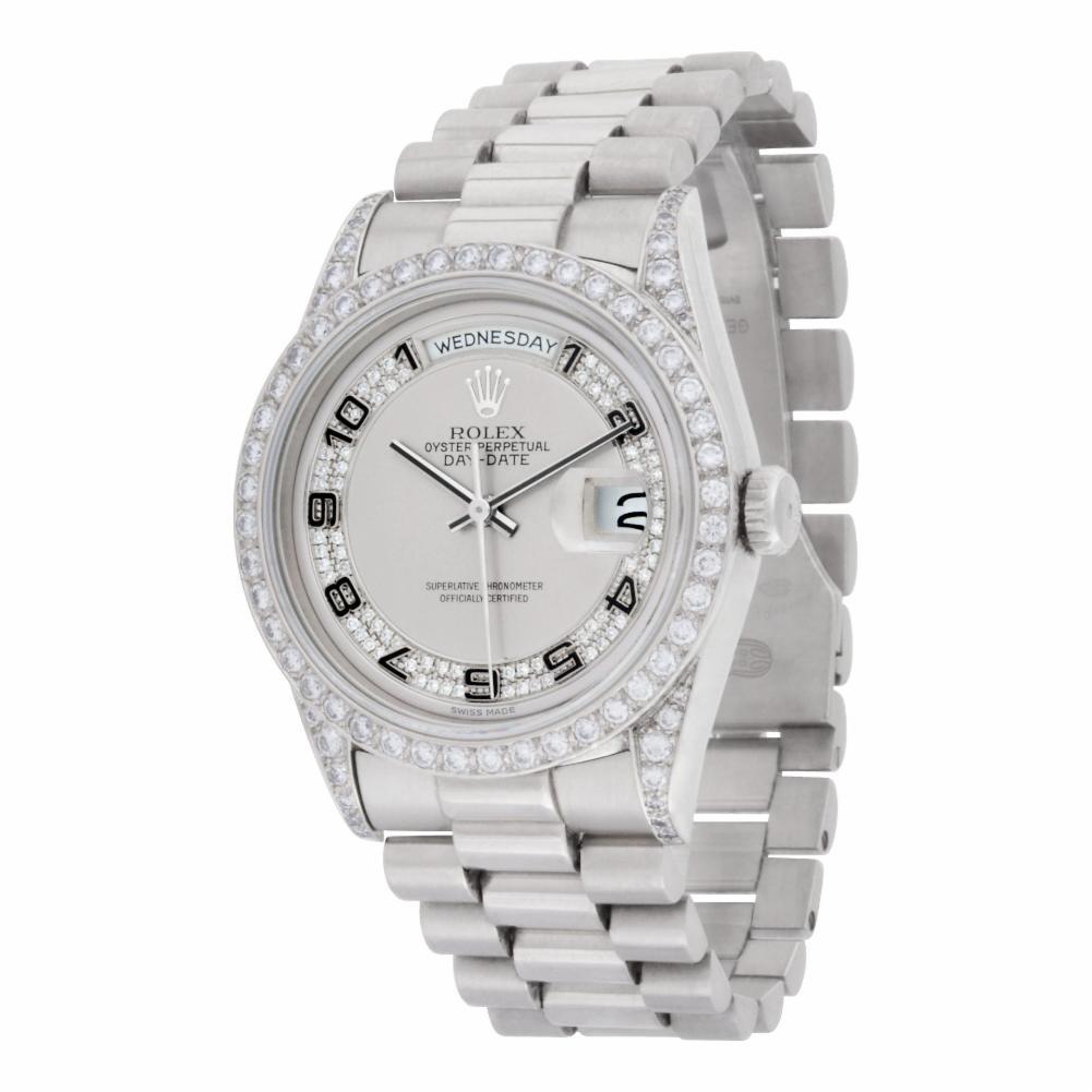 Rolex Day-Date Reference #:18206. Rolex Day -Date in platinum with genuine diamond lugs & genuine rhodium Myriad diamond dial with luxury custom diamond bezel. Auto w/ sweep seconds, date and day. 36mm case size. Ref 18206. Circa 1993. Complete with