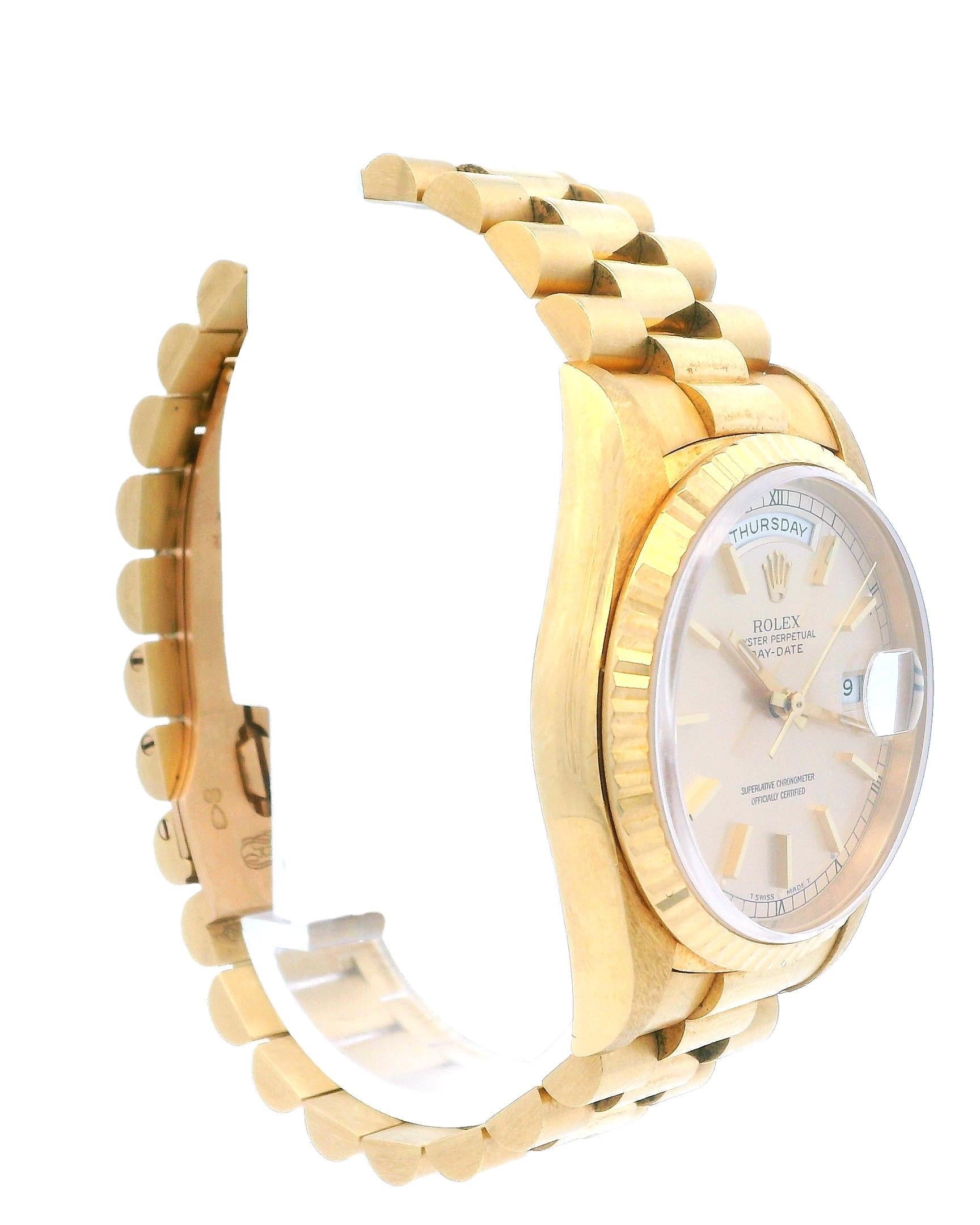 Rolex Day Date 18238 Mens Watch. 36mm 18K yellow gold case with 18K yellow gold fluted bezel. Champagne dial with gold hands and index hour marker. Date display at 3 o'clock position and day display at 12 o'clock position. 18K yellow gold President