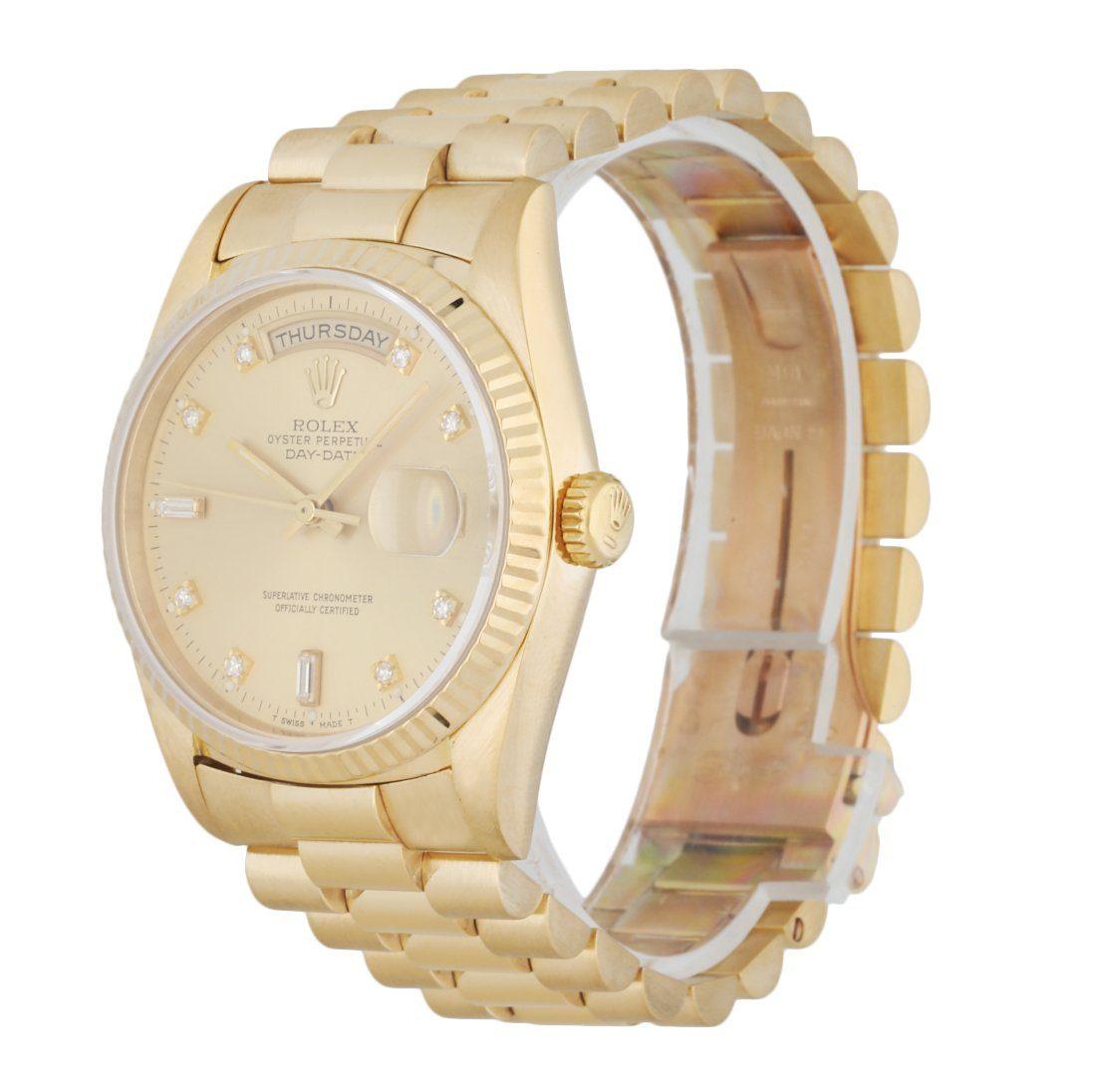 Rolex Day Date 18238 men's watch. 36MM 18K yellow gold case with 18K yellow gold fluted bezel. Champagne dial with gold luminous hands and factory diamond hour marker. Date display at 3 o'clock position & day display at 12 o'clock position. 18K