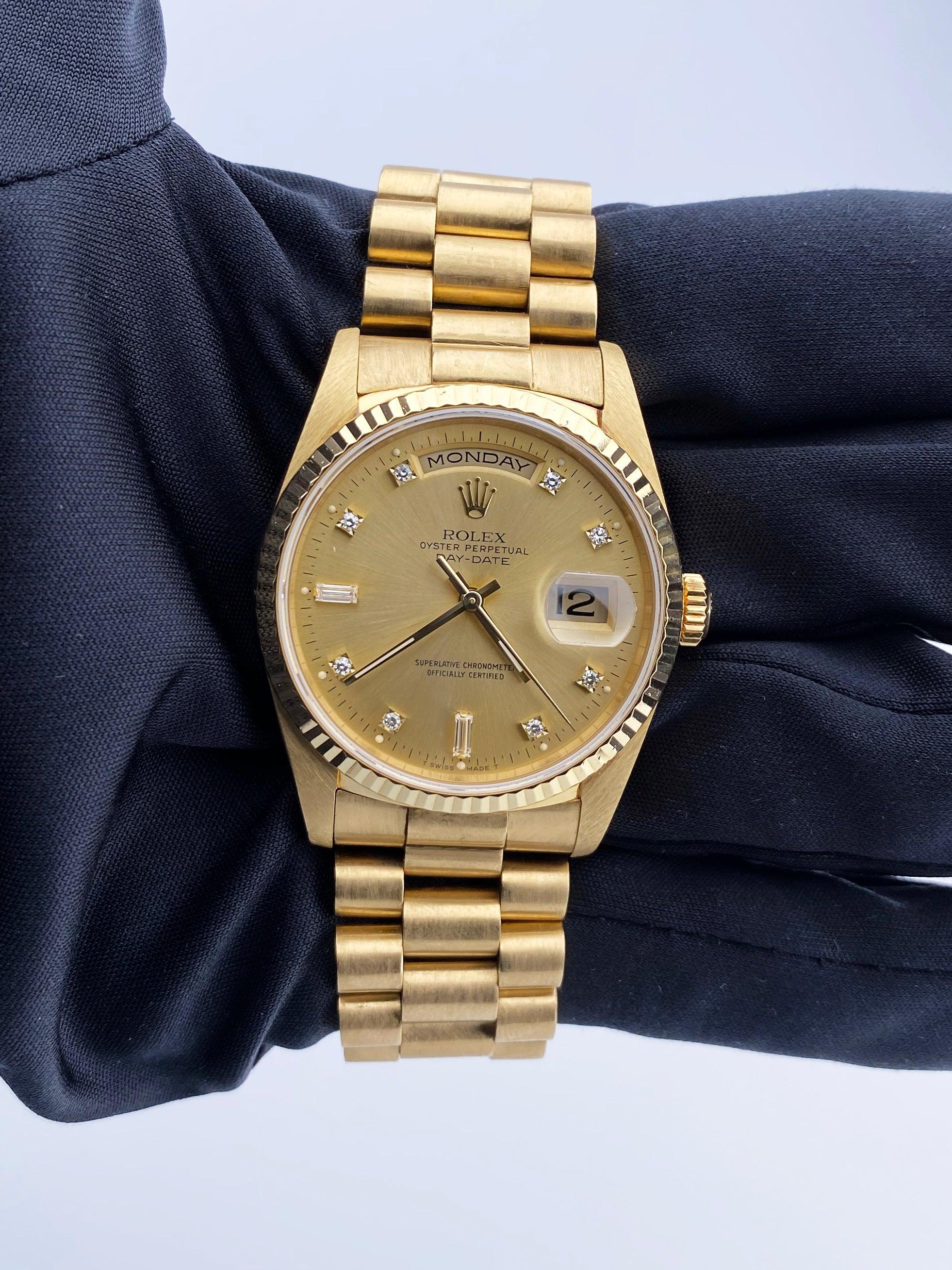 
Rolex Day Date 18238 Mens Watch. 36mm 18K yellow gold case with 18K yellow gold fluted bezel. Champagne dial with gold hands and original factory diamonds set hour marker. Date display at 3 o'clock position and day display at 12 o'clock position.