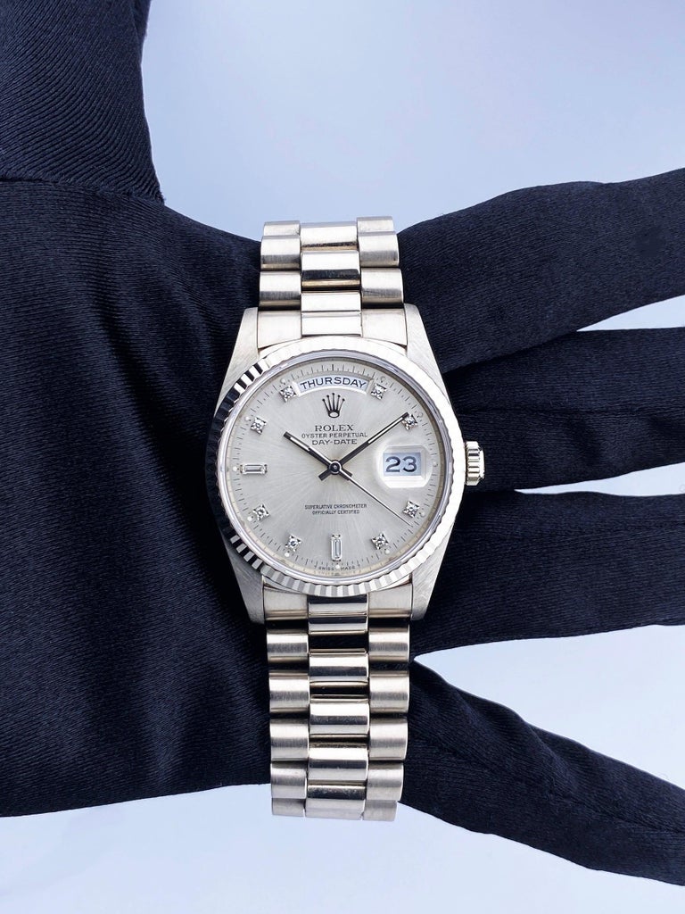 Rolex Day-Date 18239 Mens Watch. 36mm 18K white gold case with 18K white gold fluted bezel. Silver dial with silver tone hands and original factory diamonds set hour marker. Minute makers on the outer dial. Date display at 3 o'clock position & day