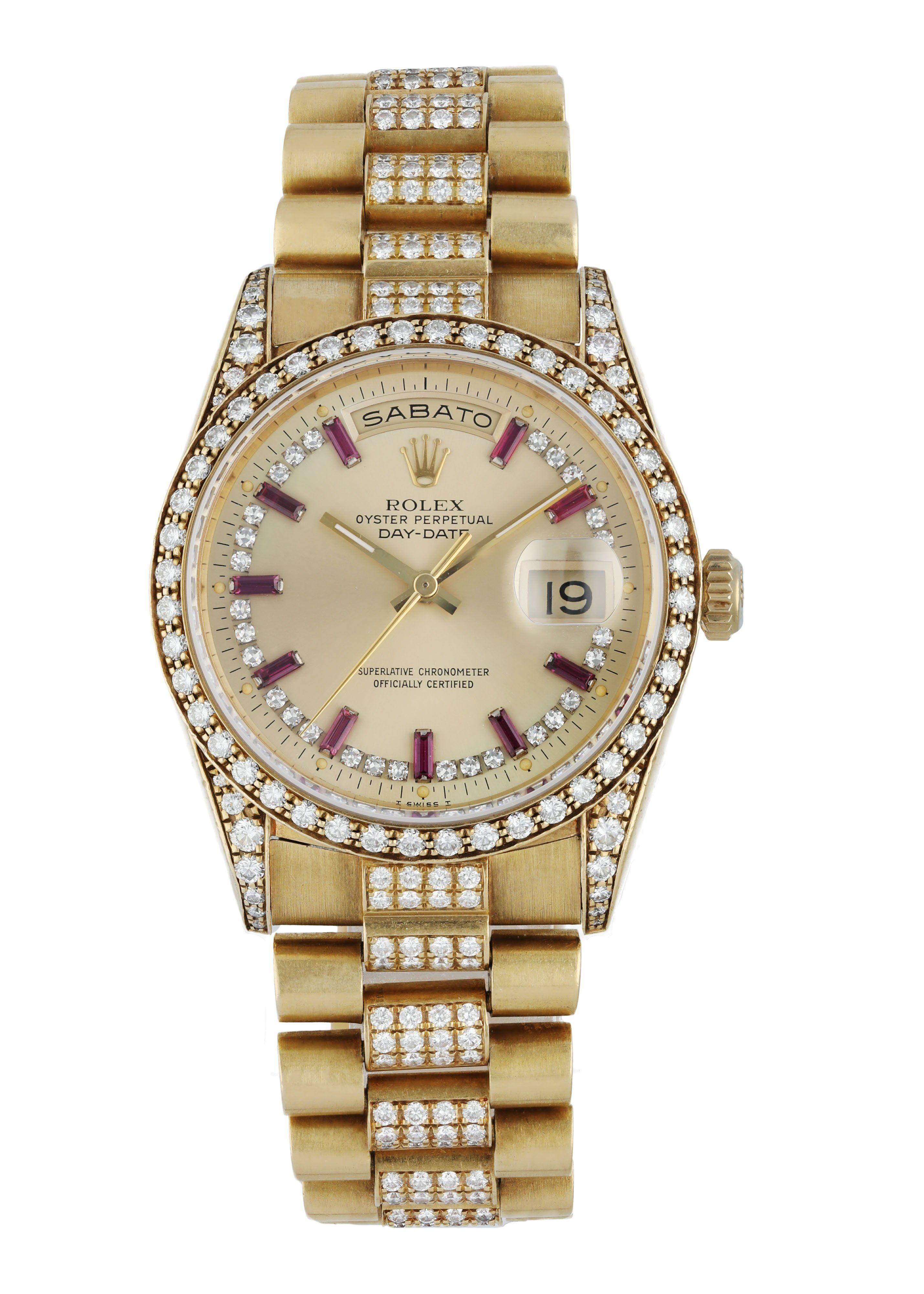 Rolex Day-Date 18388 Men's Watch. 
36mm 18k Yellow gold case with a factory set diamond.
Yellow Gold factory set diamond bezel. 
Champagne dial with gold hands, factory set diamonds, and ruby baguette index hour markers. 
Minute markers on the outer