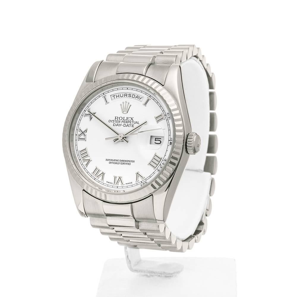 REF: W4438
MANUFACTURE: Rolex 
MODEL: Day-Date
MODEL REF: 118239
AGE: 16th September 2004
GENDER: Unisex
BOX & PAPERS: Box & Guarantee
DIAL: White Roman
GLASS: Sapphire Crystal
MOVEMENT: Automatic
WATER RESISTANCE: To Manufacturers