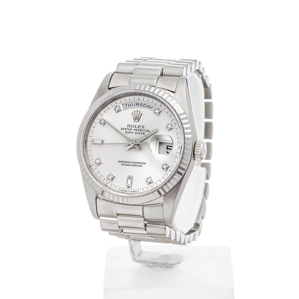 REF: W4448
MANUFACTURE: Rolex
MODEL: Day-Date
MODEL REF: 18239
AGE: Circa 1991
GENDER: Unisex
BOX & PAPERS: Box Only
DIAL: Silver & Diamond Markers
GLASS: Sapphire Crystal
MOVEMENT: Automatic
WATER RESISTANCY: To Manufacturers Specifications
CASE