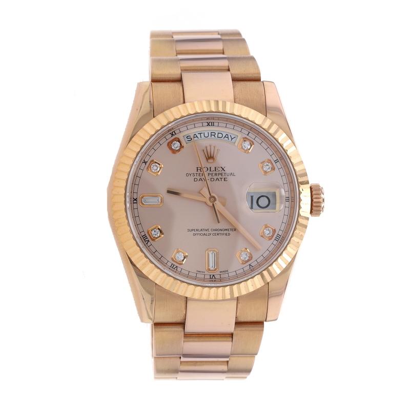Brand: Rolex  
Model: Day-Date 36
Model Number: 118235
Dial Color: Pink Diamond
Year: 2012
Metal Content: 18k Rose Gold 
Movement: Swiss Automatic 3155
Number of Jewels: 31
Gender: Unisex/Ladies
Warranty: One-Year

Stone Information
Natural