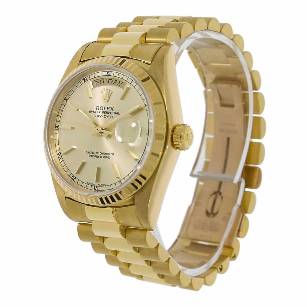 Rolex Day-Date Reference #:18038. Rolex 18K Yellow Gold Day Date ref 18038. Featuring a 36mm diameter case with fluted bezel, sapphire crystal, and classic original champagne gold Index dial. Powered by calibre 3055 self winding movement with sweep