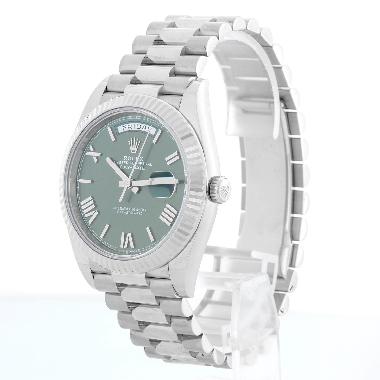 Rolex Day-Date 40 President 18k White Gold Men's 40mm Watch 228239 - Automatic winding, 31 jewels, sapphire crystal, with day and date. Day-Date II. White gold with fluted bezel (40mm diameter). Olive dial. 18k White gold President bracelet.