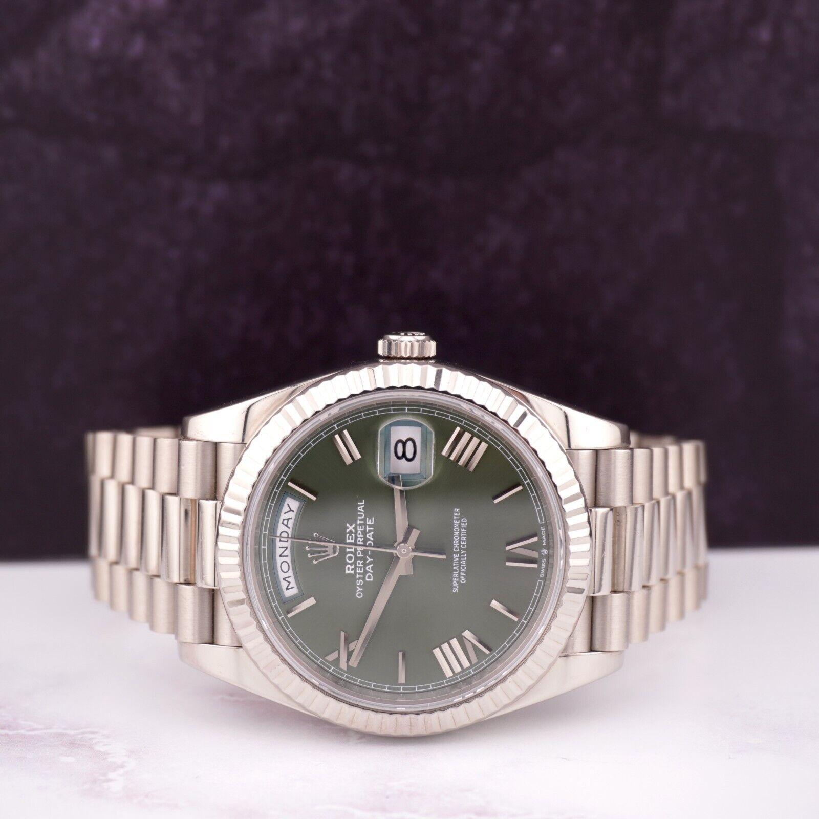 Rolex Daydate 40mm Watch

Pre-owned w/ Original Box & Card
100% Authentic Authenticity Card
Condition - (Excellent Condition) - See Pics
Watch Reference - 228239
Model - Day-Date
Dial Color - Olive Green
Material - 18k White Gold
Watch Will Fit