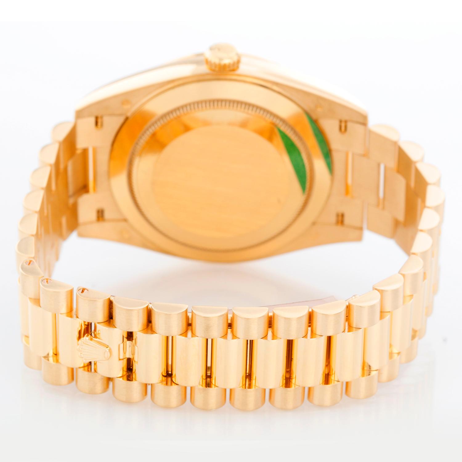 Rolex Day-Date 40 President 18k Yellow Gold Men's 40mm Watch 228238 - Automatic winding, 31 jewels, sapphire crystal, with day and date. 18K Yellow gold; fluted bezel (40mm diameter). Factory black baguette diamond dial. 18k yellow gold President