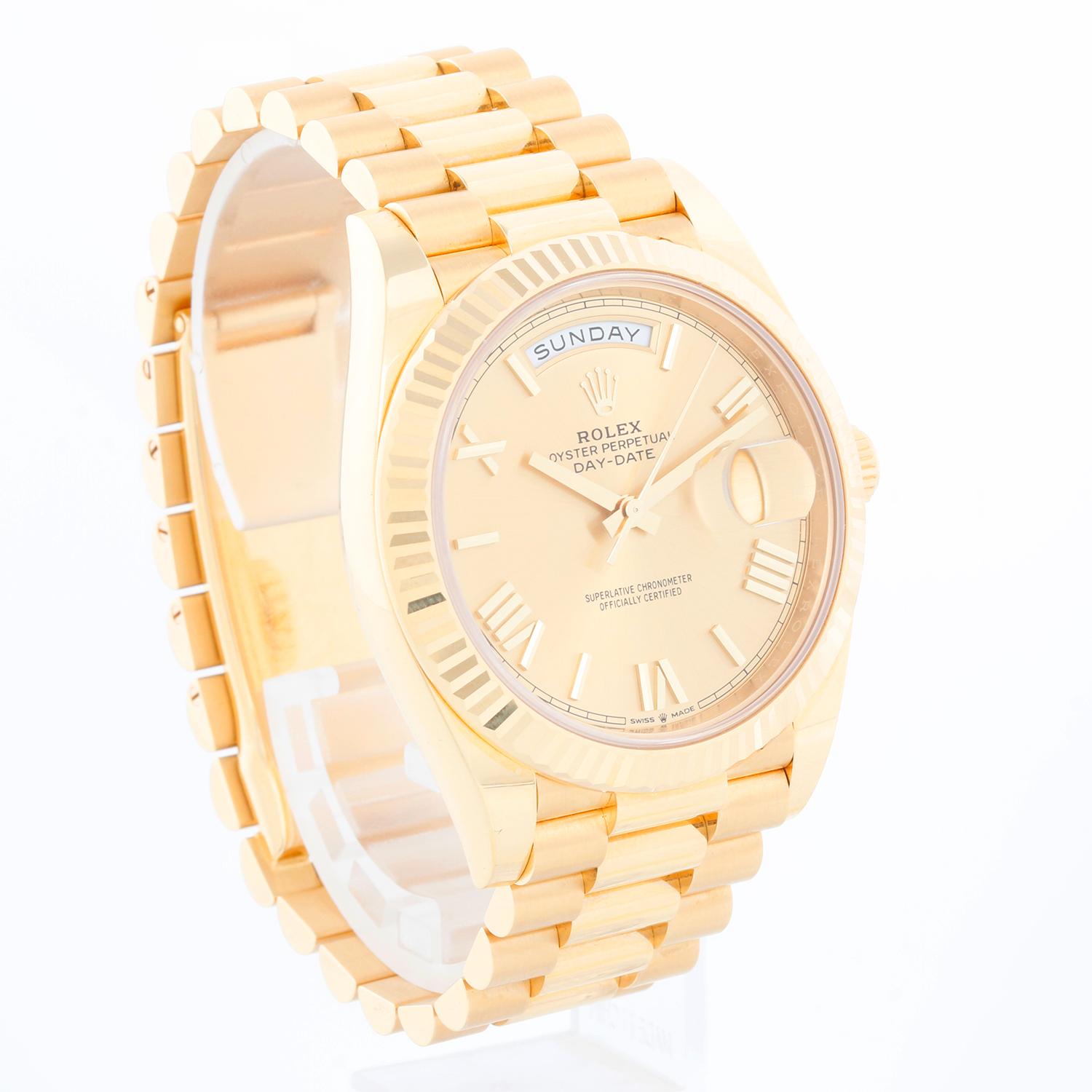 Rolex Day-Date 40 President 18k Yellow Gold Men's 40mm Watch 228238 - Automatic winding, 31 jewels, sapphire crystal, with day and date. Yellow gold with fluted bezel (40mm diameter). Champagne dial with Roman numerals. 18k yellow gold President