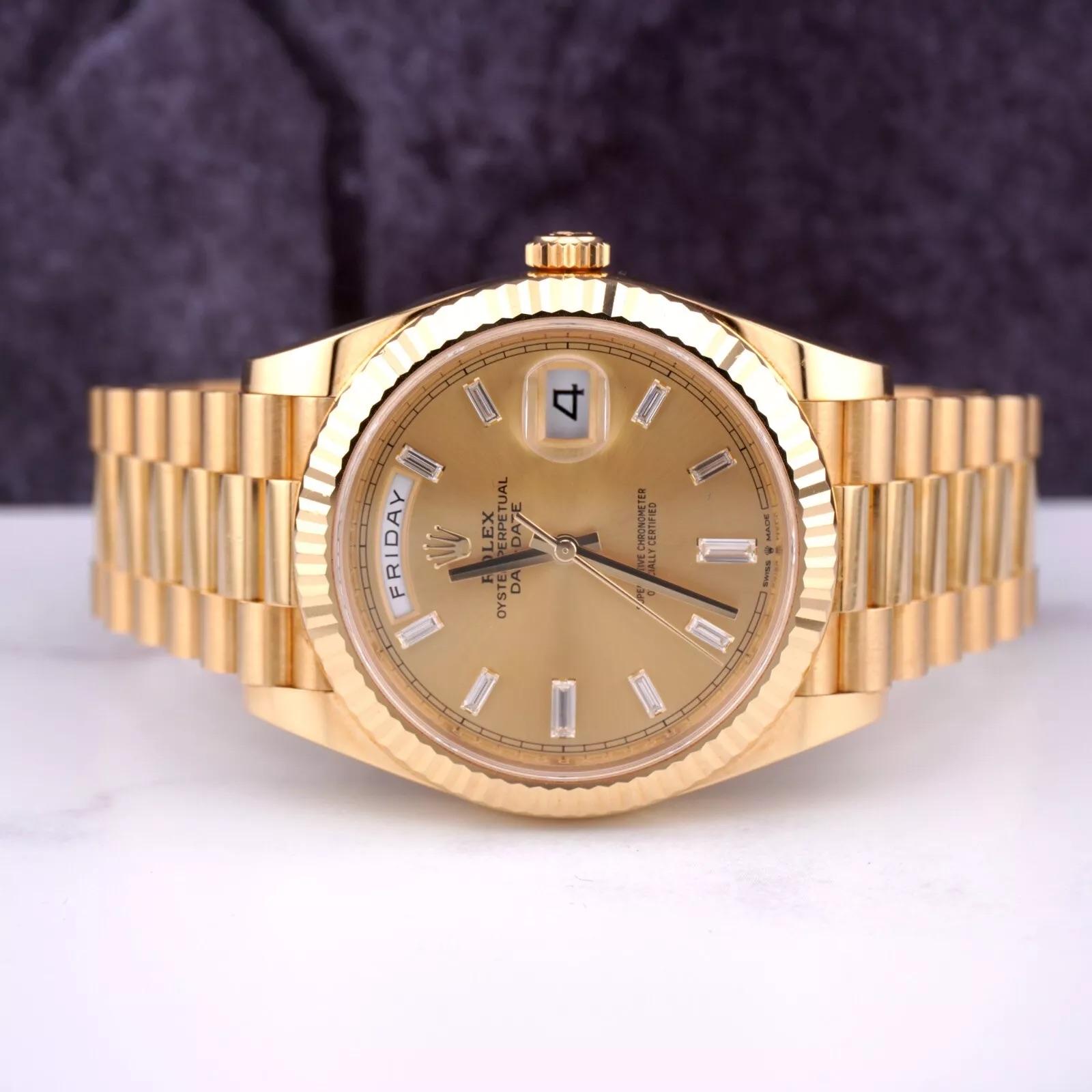 Rolex Day-Date 40mm Watch

		Pre-owned w/ Original Box & Card
		100% Authentic Authenticity Card
		Condition - (Excellent Condition) - See Pics
		Watch Reference - 228238
		Model - Day-Date
		Dial Color - Gold Diamond Dial
		Material - 18k Yellow