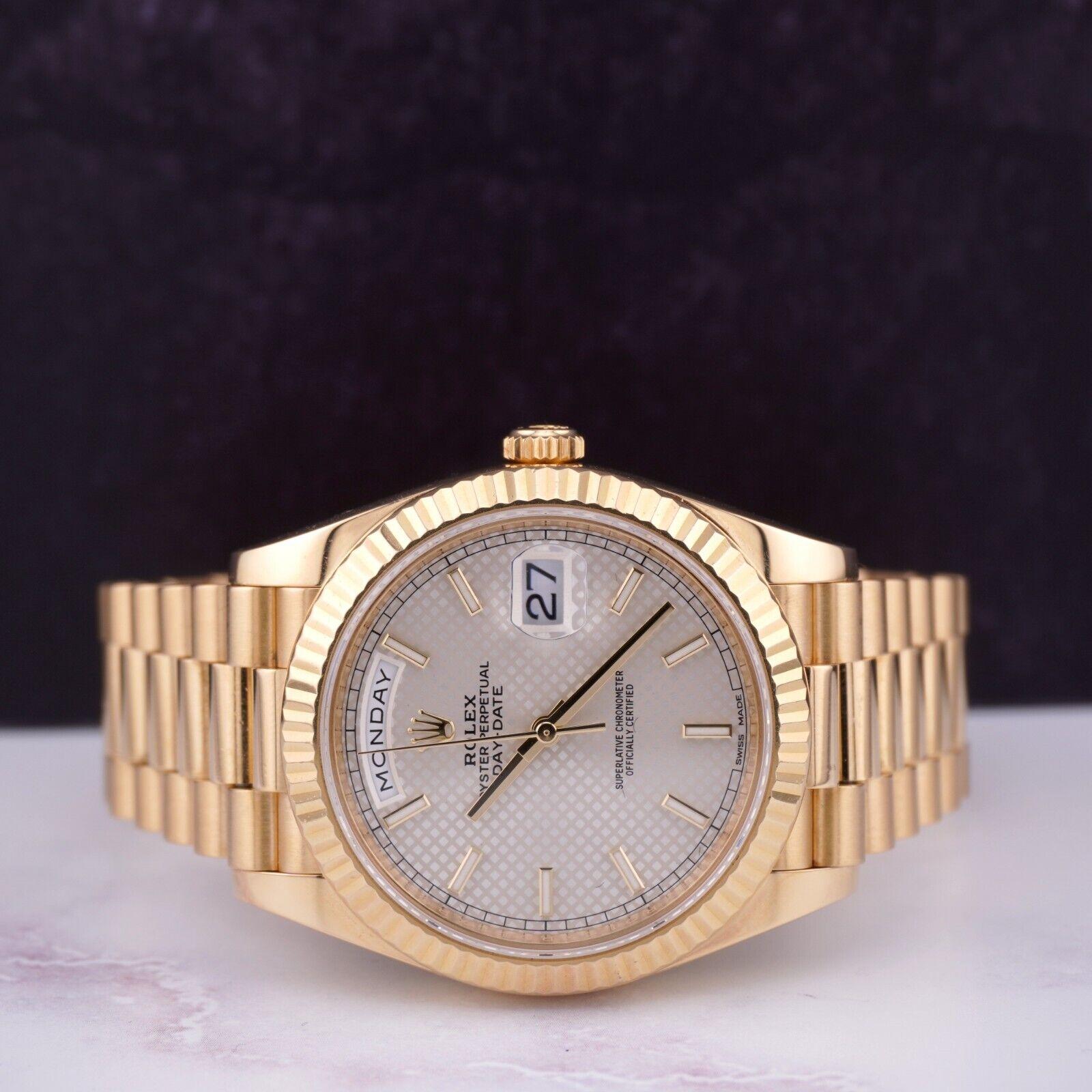 Rolex Day-Date 40mm Watch

Pre-owned w/ Original Box & Card
100% Authentic Authenticity Card
Condition - (Excellent Condition) - See Pics
Watch Reference - 228238
Model - Day-Date
Dial Color - Silver
Material - 18k Yellow Gold
Watch Will Fit Wrist