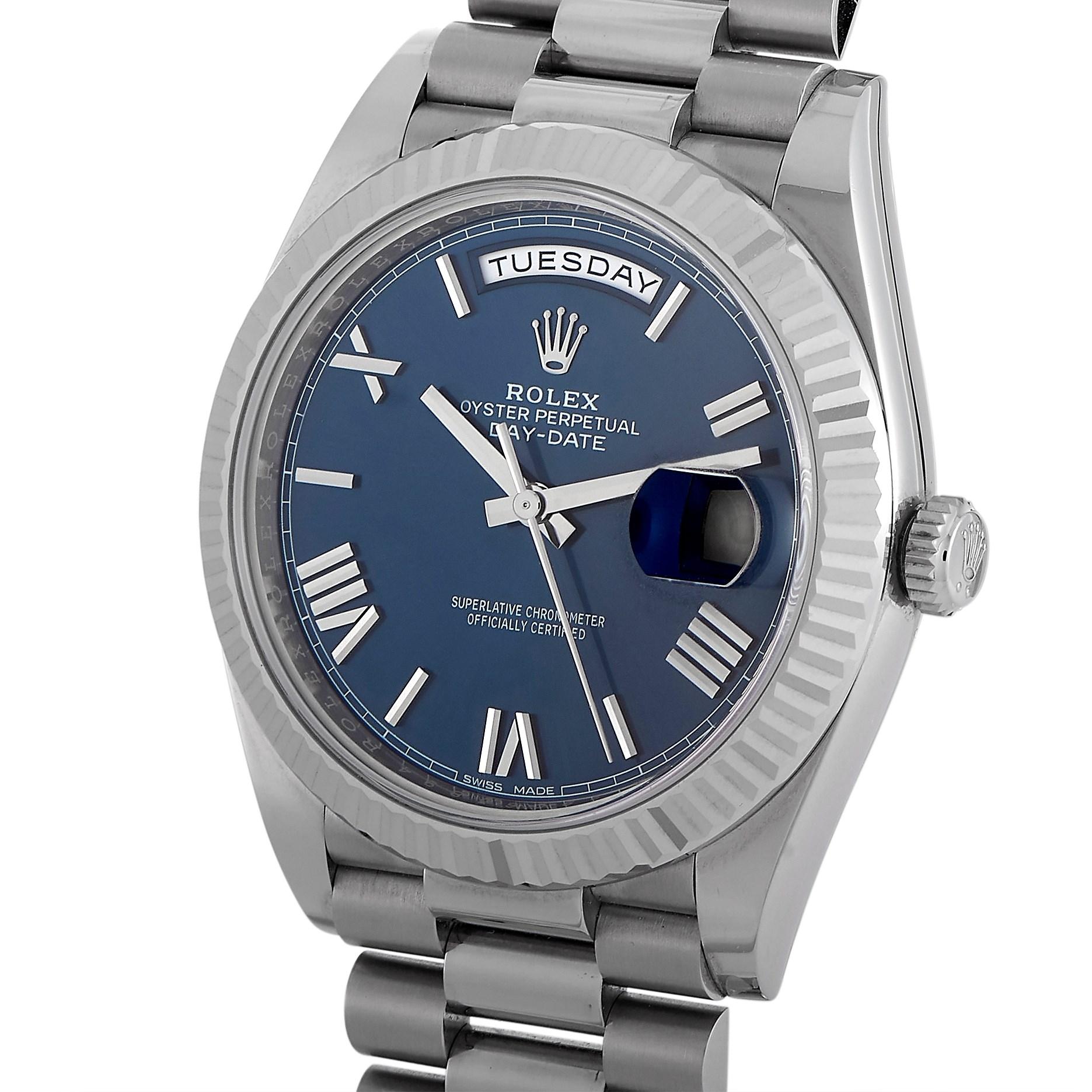 A masculine gold watch with a statement-making simplicity. The Rolex Day-Date 40 18K White Gold President Blue Dial Automatic Men's Watch 228239BLRP attracts eyes without having to look bold. it features a 40mm polished 18K white gold case and an
