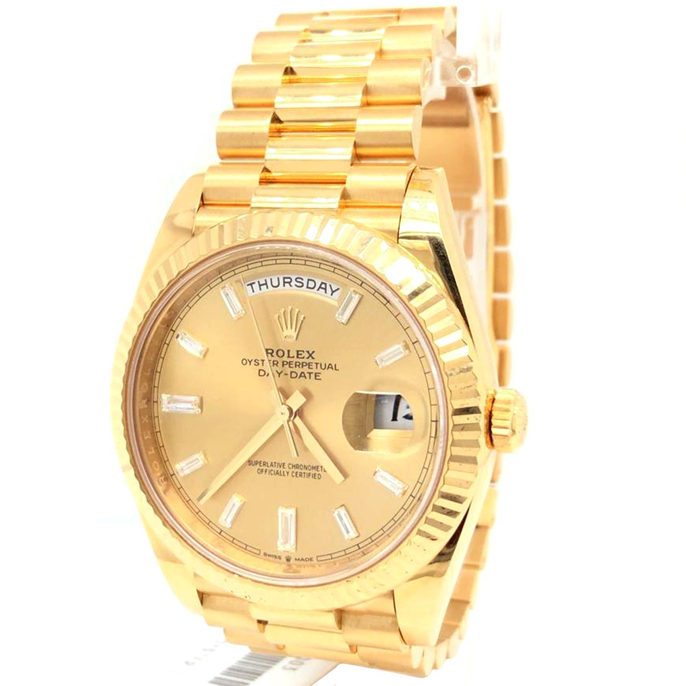 The Oyster Perpetual Day-Date 40 in 18 ct yellow gold with a white dial, fluted bezel, and a President bracelet. The Day-Date was the first watch to indicate the day of the week spelled out in full when it was first presented in 1956. The Rolex