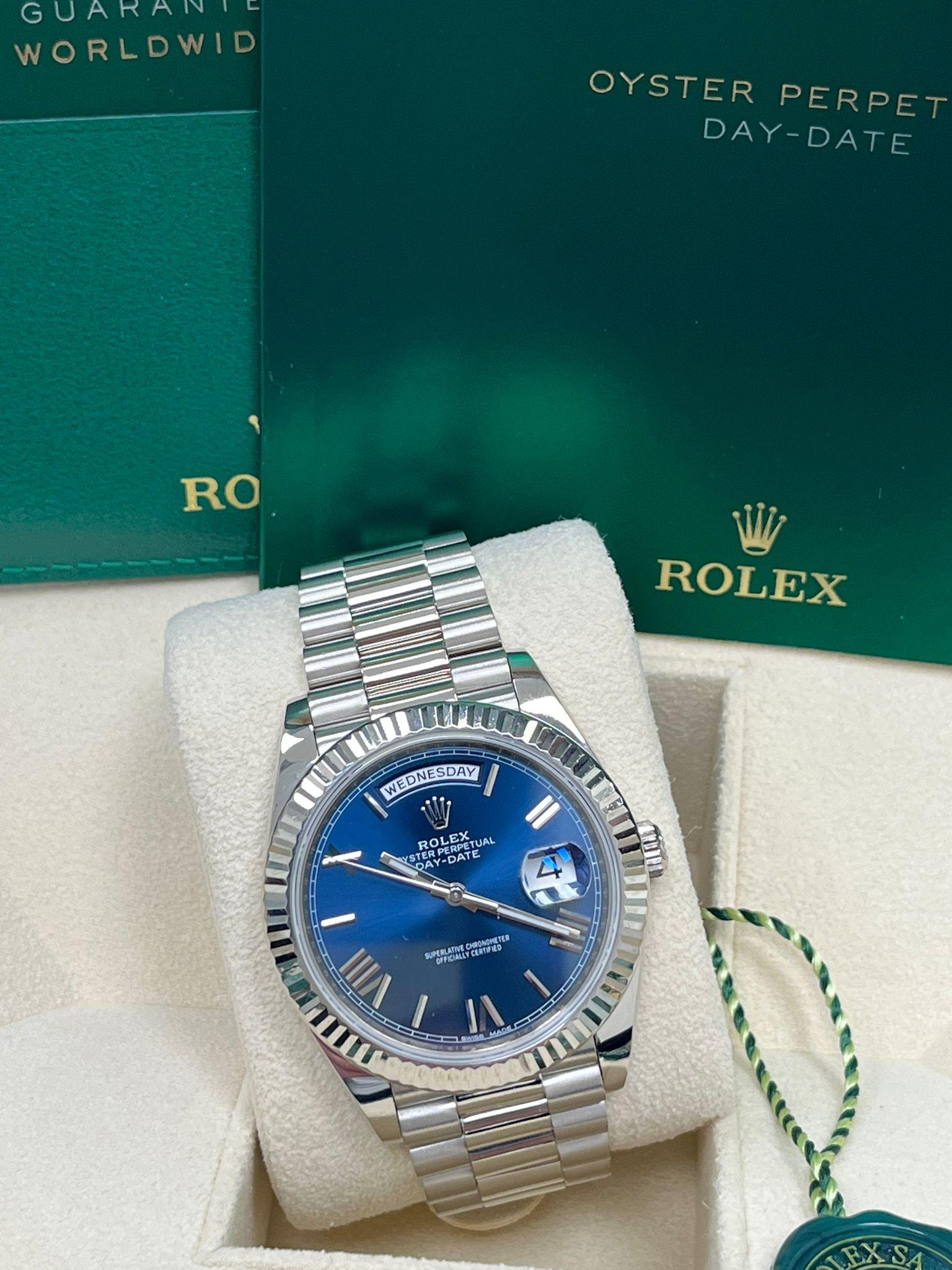 Women's or Men's Rolex Day-Date 40mm White Gold Bright Blue Roman Dial Fluted Bezel Watch 228239 For Sale