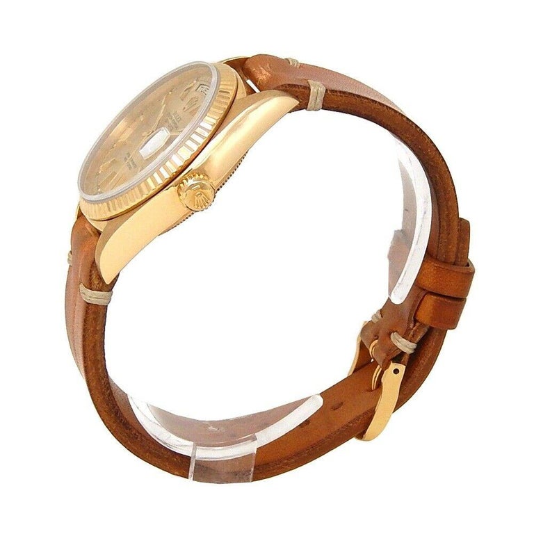 Brand: Rolex
Band Color: Brown	
Gender:	Men's
Case Size: 36mm	
MPN: Does Not Apply
Lug Width: 20mm	
Features:	Date Indicator, Day Indicator, Gold Bezel, Roman Numerals, Sapphire Crystal, Swiss Made, Swiss Movement
Style: Casual	
Movement: Mechanical