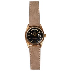 Reloj Rolex Day Date con esfera negra Wideboy de oro amarillo de 18 quilates, años 70