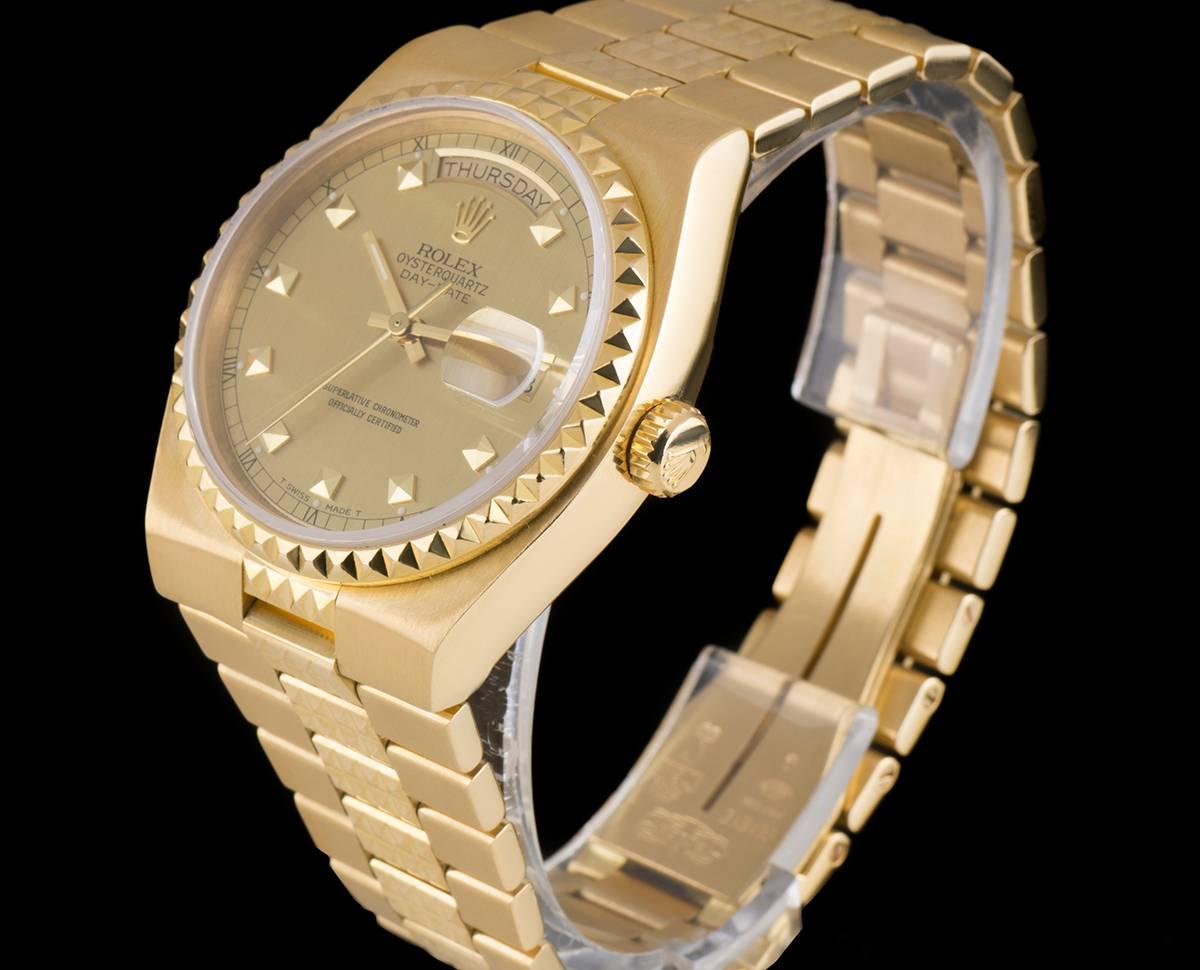 A Rare 18k Yellow Gold Egyptian Oysterquartz Day-Date Gents Wristwatch, champagne dial with 10 applied pyramid hour markers, day at 12 0'clock, date at 3 0'clock, a fixed 18k yellow gold pyramid style bezel, an 18k yellow gold oysterquartz bracelet