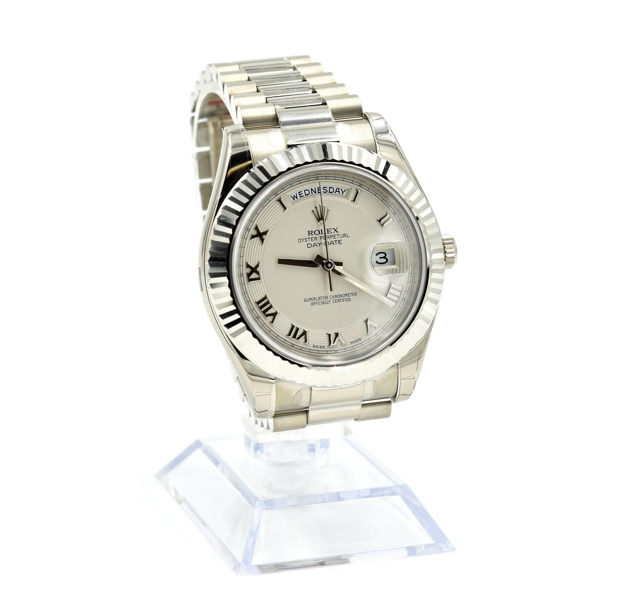 Movement: Swiss made Rolex Caliber 3156 automatic movement
Function: hours, minutes, seconds, day, date
Case: round 41mm 18k white gold case, 18k white gold fluted bezel, sapphire protective crystal, screw down crown, water resistant to 100