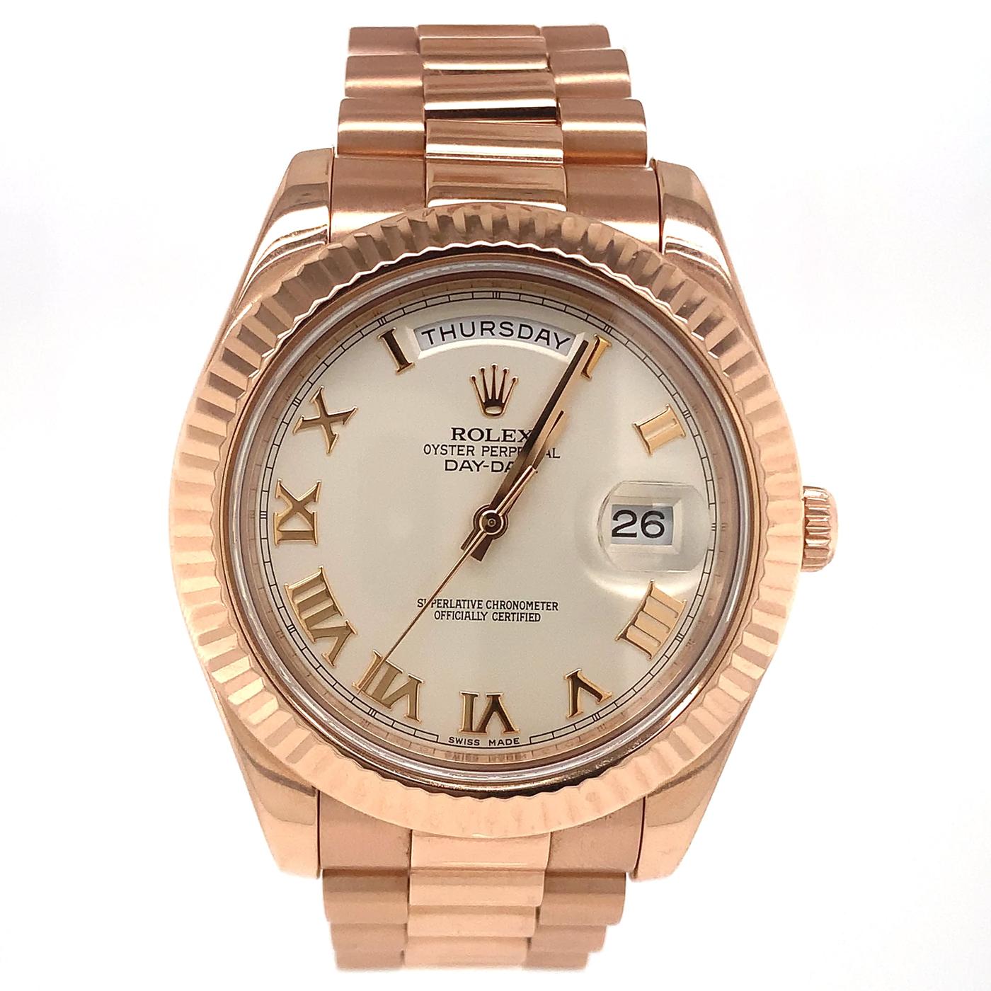 The Oyster Perpetual Day-Date II 41mm in 18 ct Everose gold with chocolate, fluted bezel, and a President bracelet. The Day-Date was the first watch to indicate the day of the week spelled out in full when it was first presented in 1956. It is