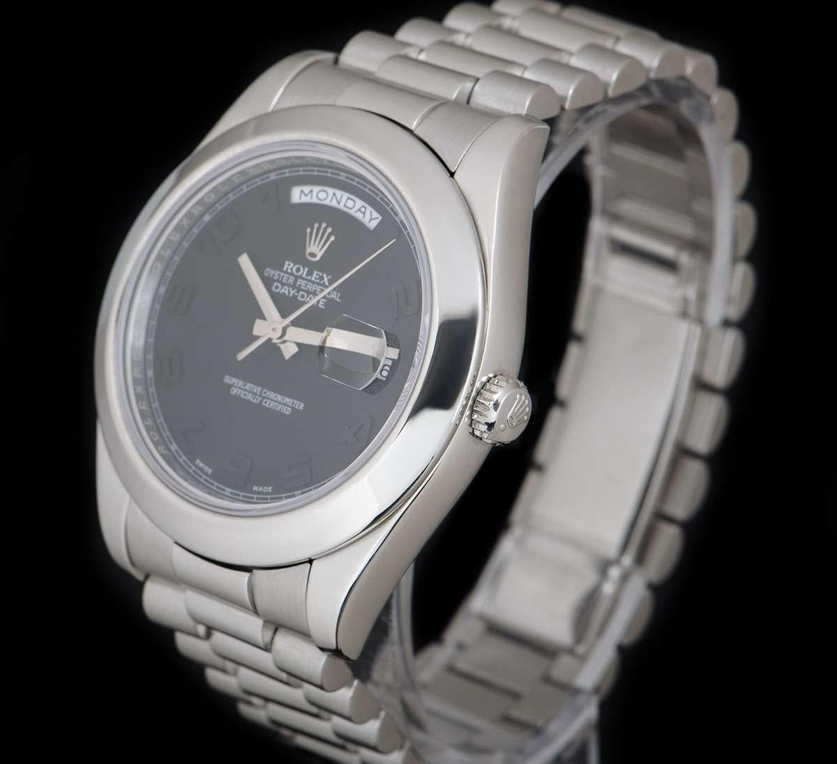 A 2008 41mm Platinum Oyster Perpetual Day-Date II Gents Wristwatch, black dial with applied arabic numbers, day aperture at 12 0'clock, date aperture at 3 0'clock, a fixed platinum smooth bezel, a platinum president bracelet with a concealed