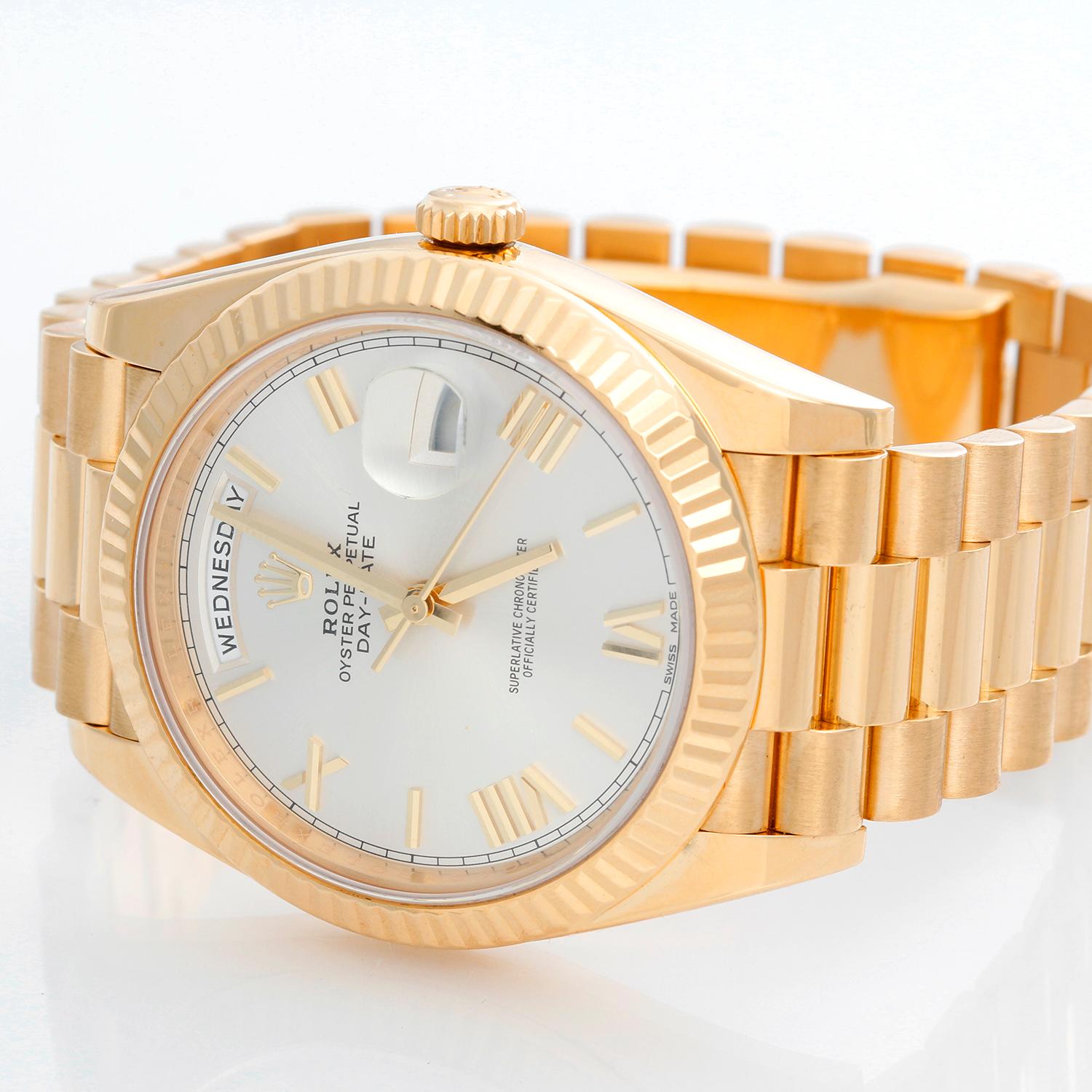 Rolex Day-Date II President 18k Yellow Gold Men's 40mm Watch 228238 - Automatic winding, 31 jewels, sapphire crystal, with day and date. 18K Yellow gold; fluted bezel  (40mm diameter). Black dial with baguette  hour markers. 18k yellow gold