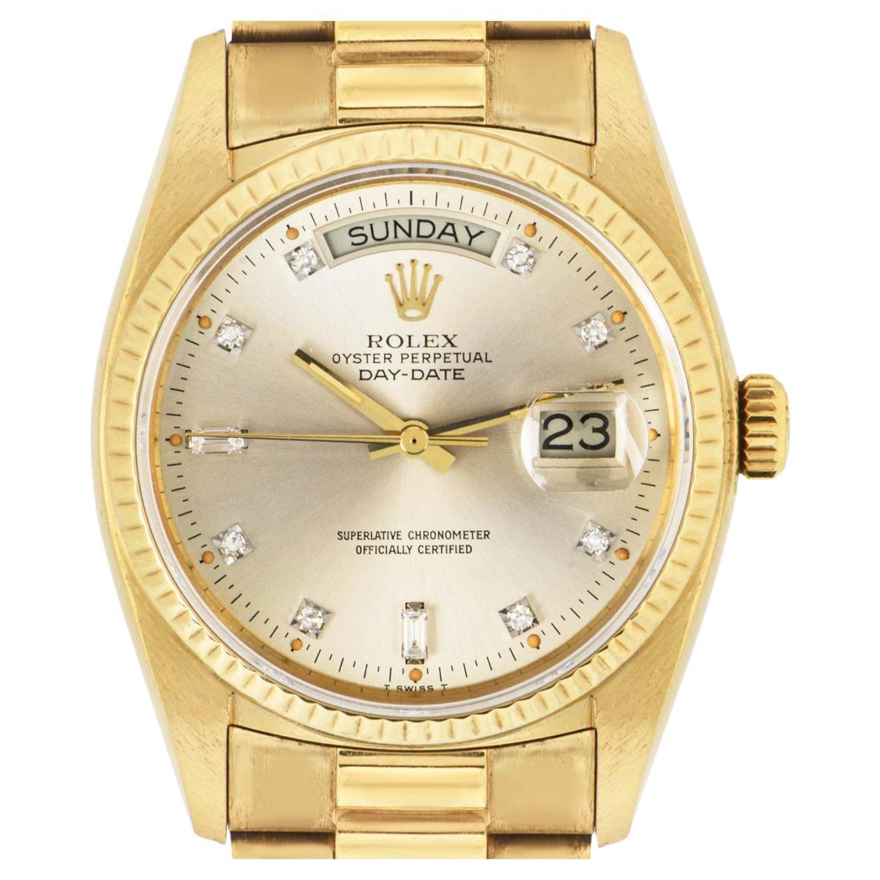 A yellow gold NOS Day-Date by Rolex. Featuring a champagne dial set with 8 round brilliant cut diamond hour markers, 2 baguette cut diamond hour markers and a fixed yellow gold fluted bezel.

Equipped with a yellow gold president bracelet and a