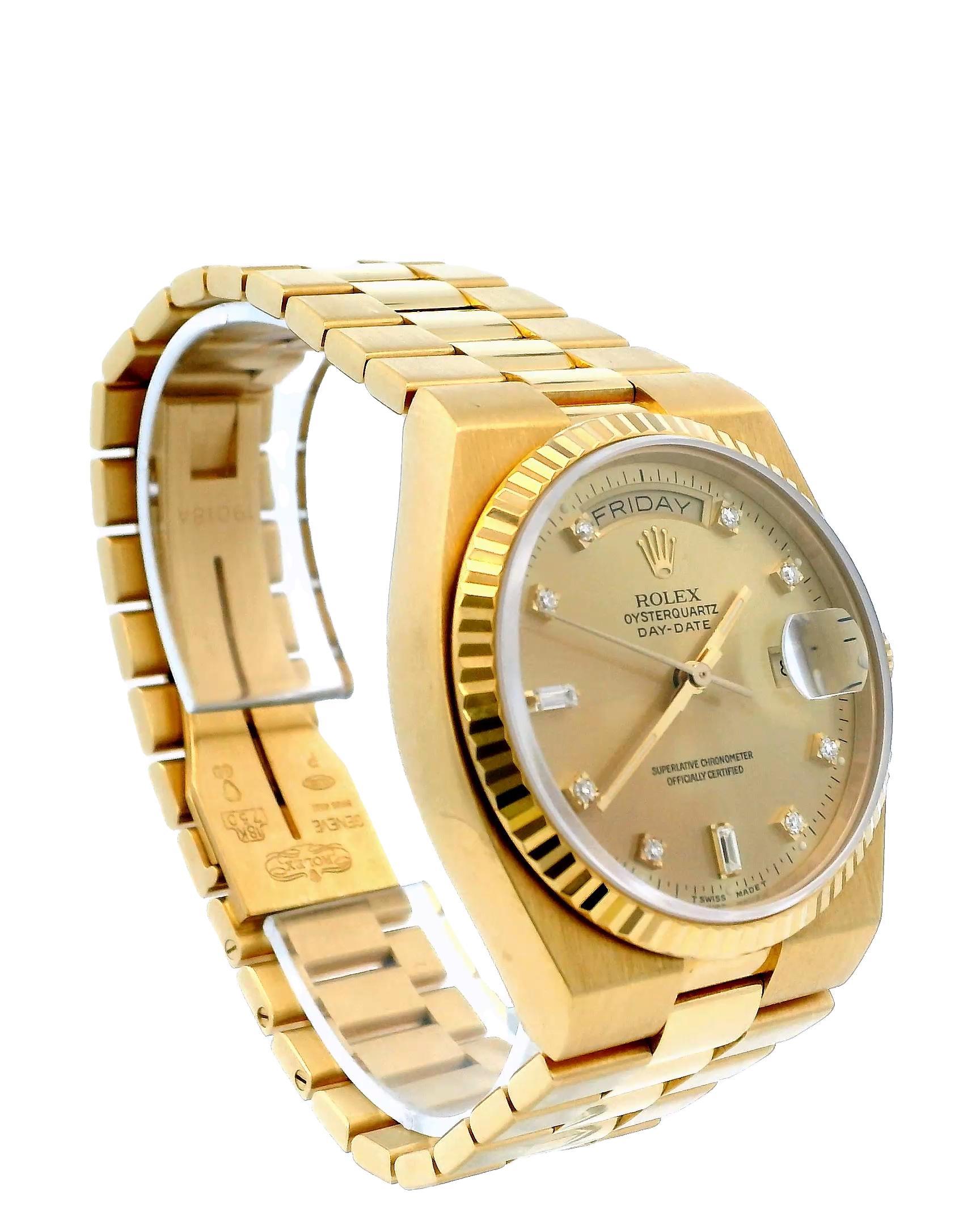 Montre pour homme Rolex Oysterquartz President Day-Date 19018. Boîtier de 36 mm en or jaune 18 carats avec lunette cannelée en or jaune 18 carats. Cadran champagne avec aiguilles en or et index sertis de diamants d'usine. Affichage de la date à 3