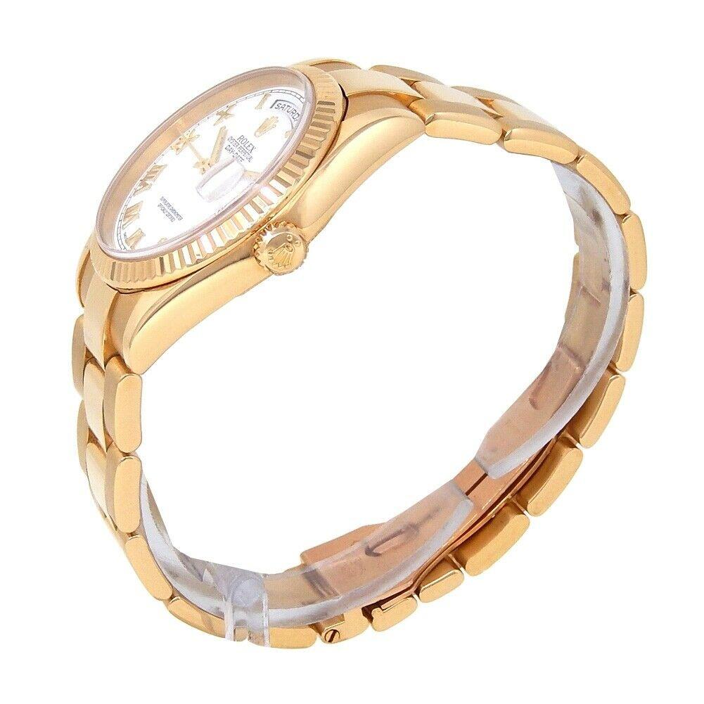 Brand: Rolex
Band Color: Yellow Gold	
Gender:	Men's
Case Size: 36mm	
MPN: Does Not Apply
Lug Width: 19mm	
Features:	12-Hour Dial, Date Indicator, Day Indicator, Roman Numerals, Sapphire Crystal, Screwdown Crown, Swiss Made, Swiss Movement
Style: